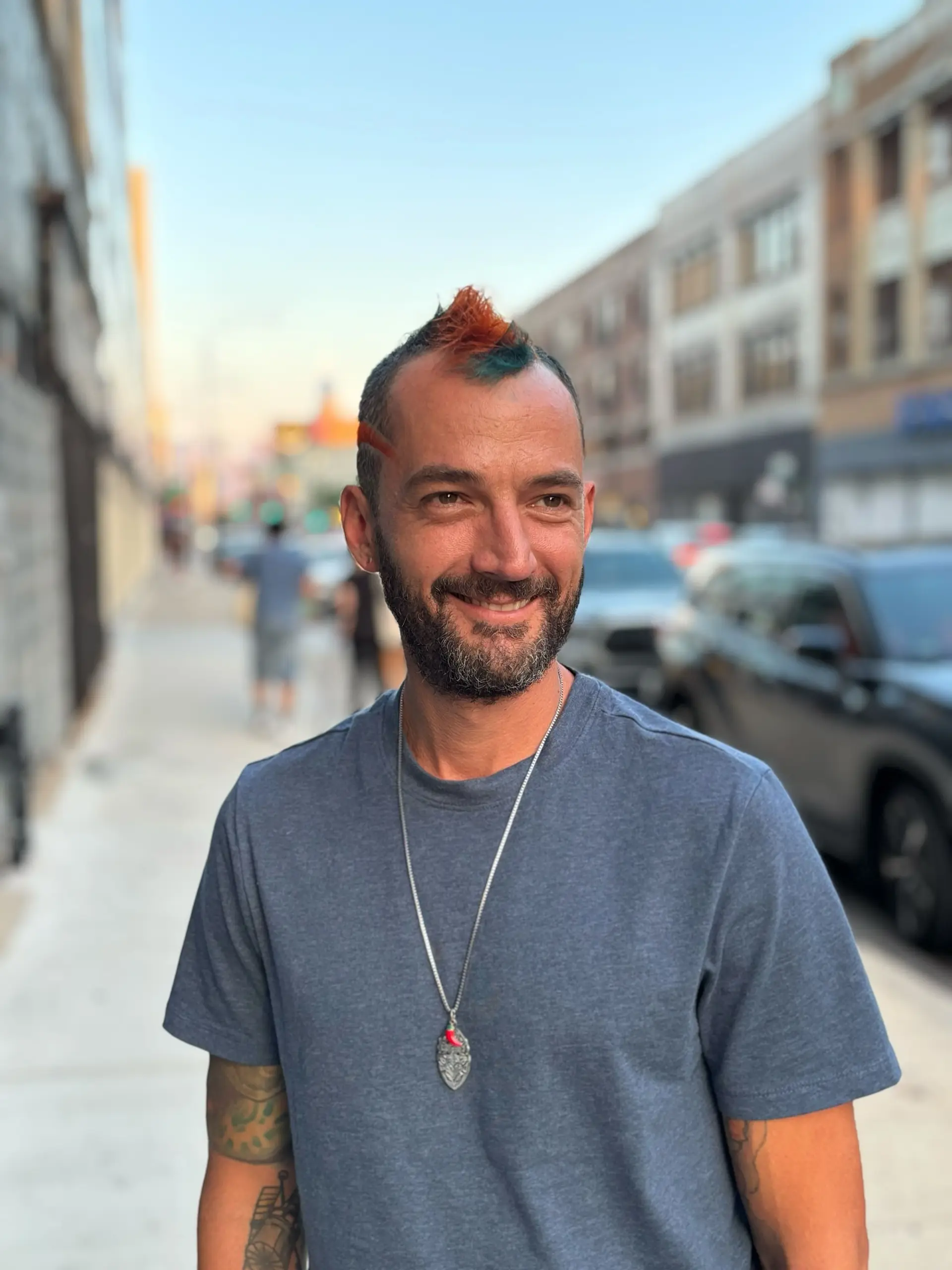 A modern take on a mullet and mohawk, combining the edgy silhouette with colorful spikes. 1