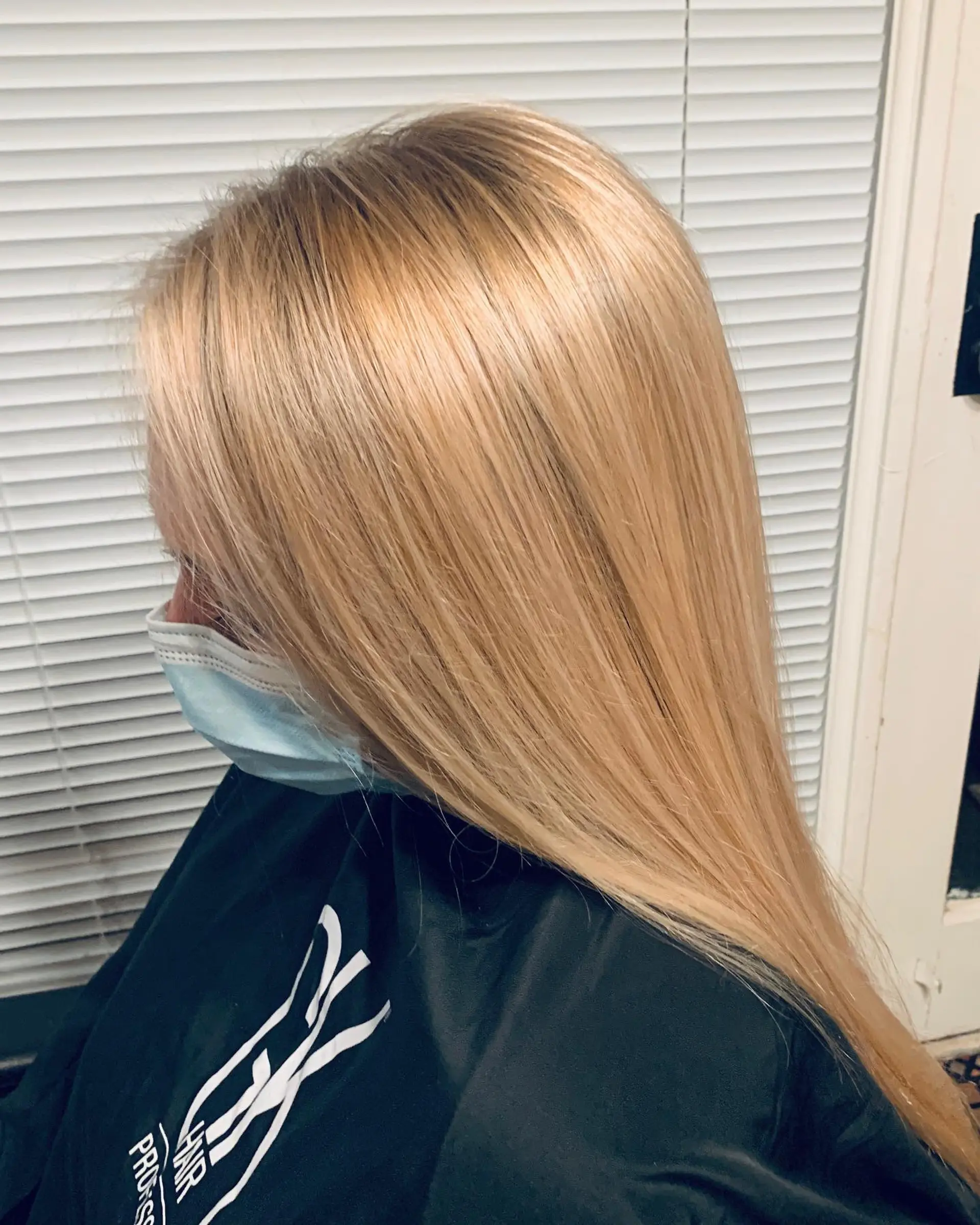 Long straight hair styled with a dimensional warm blonde balayage and a smooth finish. 1