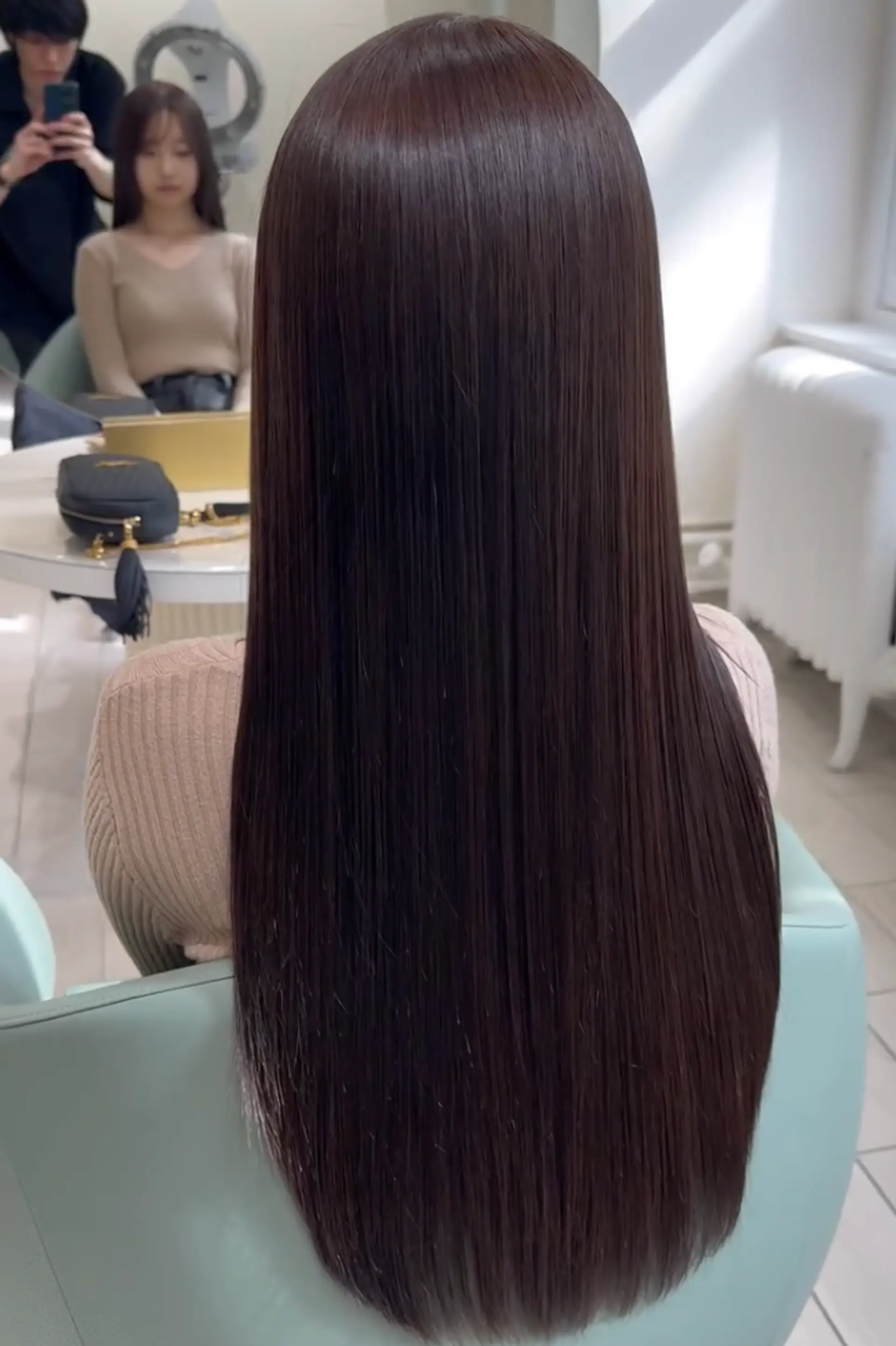 Very long, straight dark brown hair with a glossy finish, featuring a middle part. The hair is well-maintained and has a smooth, sleek texture.
 1