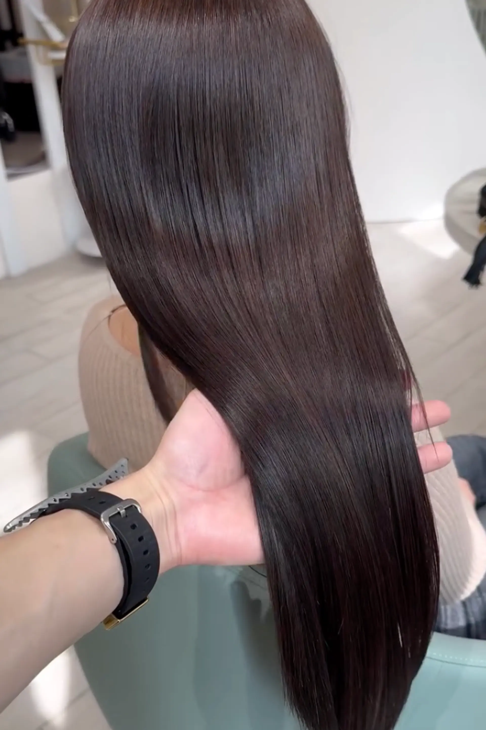 Very long, straight dark brown hair with a glossy finish, featuring a middle part. The hair is well-maintained and has a smooth, sleek texture.
 2