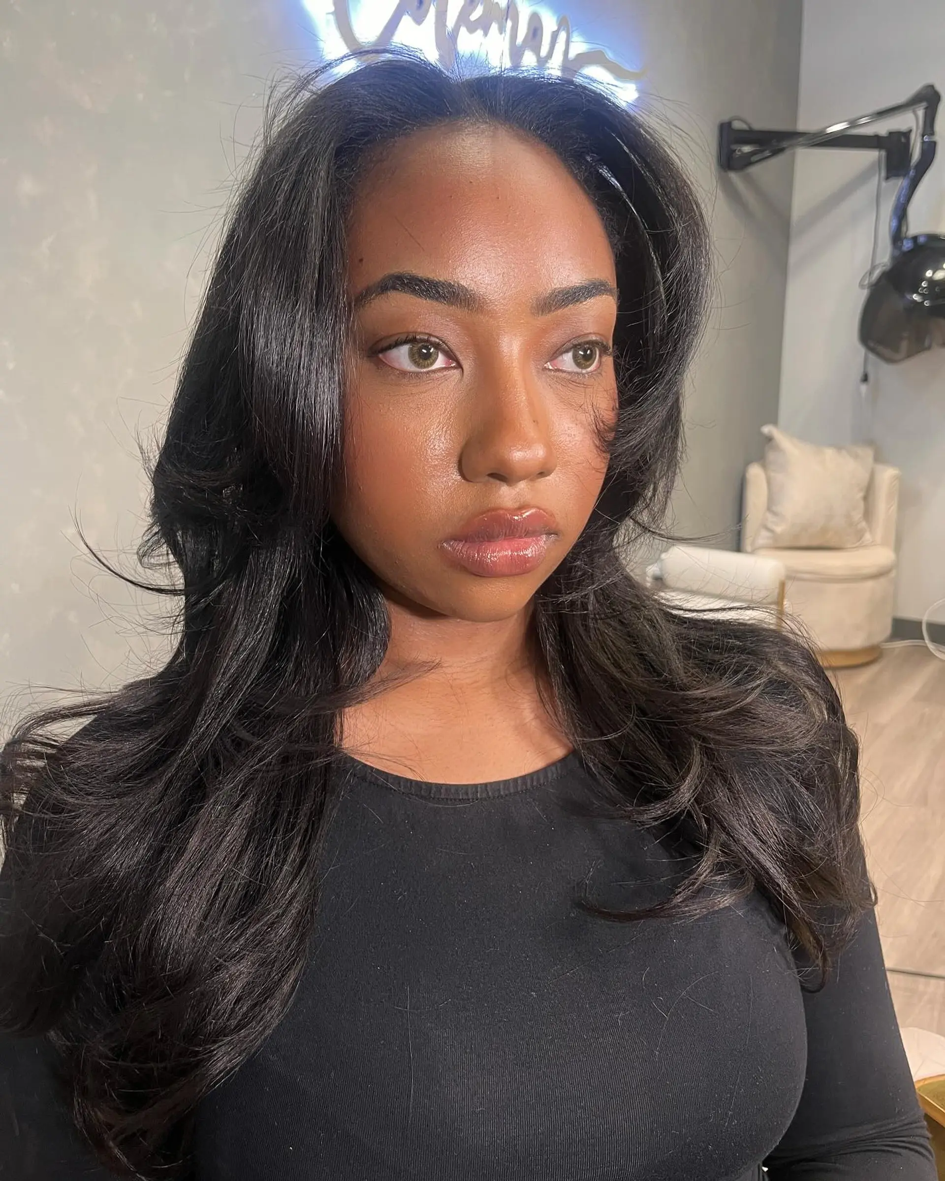 A long, layered hairstyle with a voluminous blowout. 1