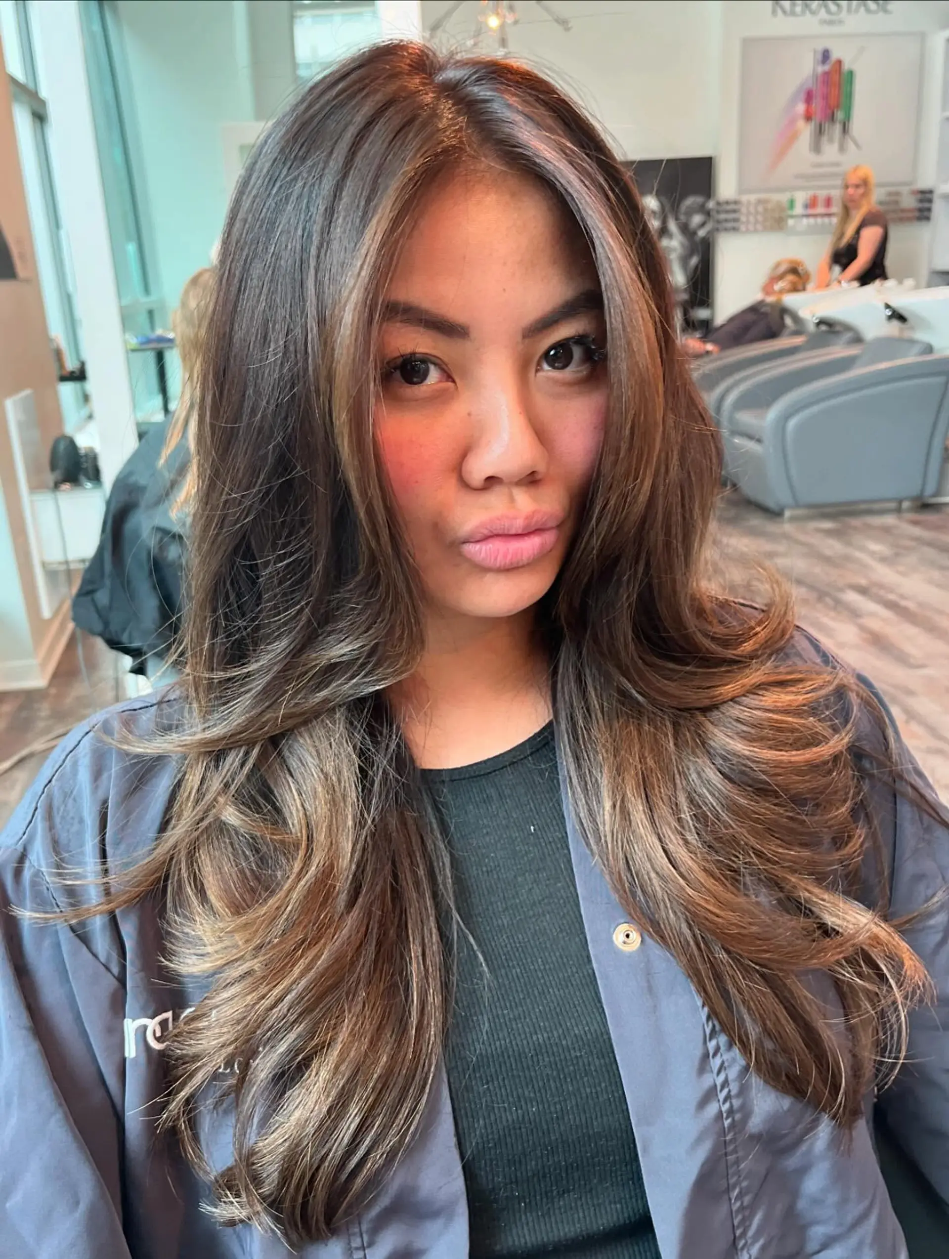 Long wavy hair with a dimensional caramel balayage. 1