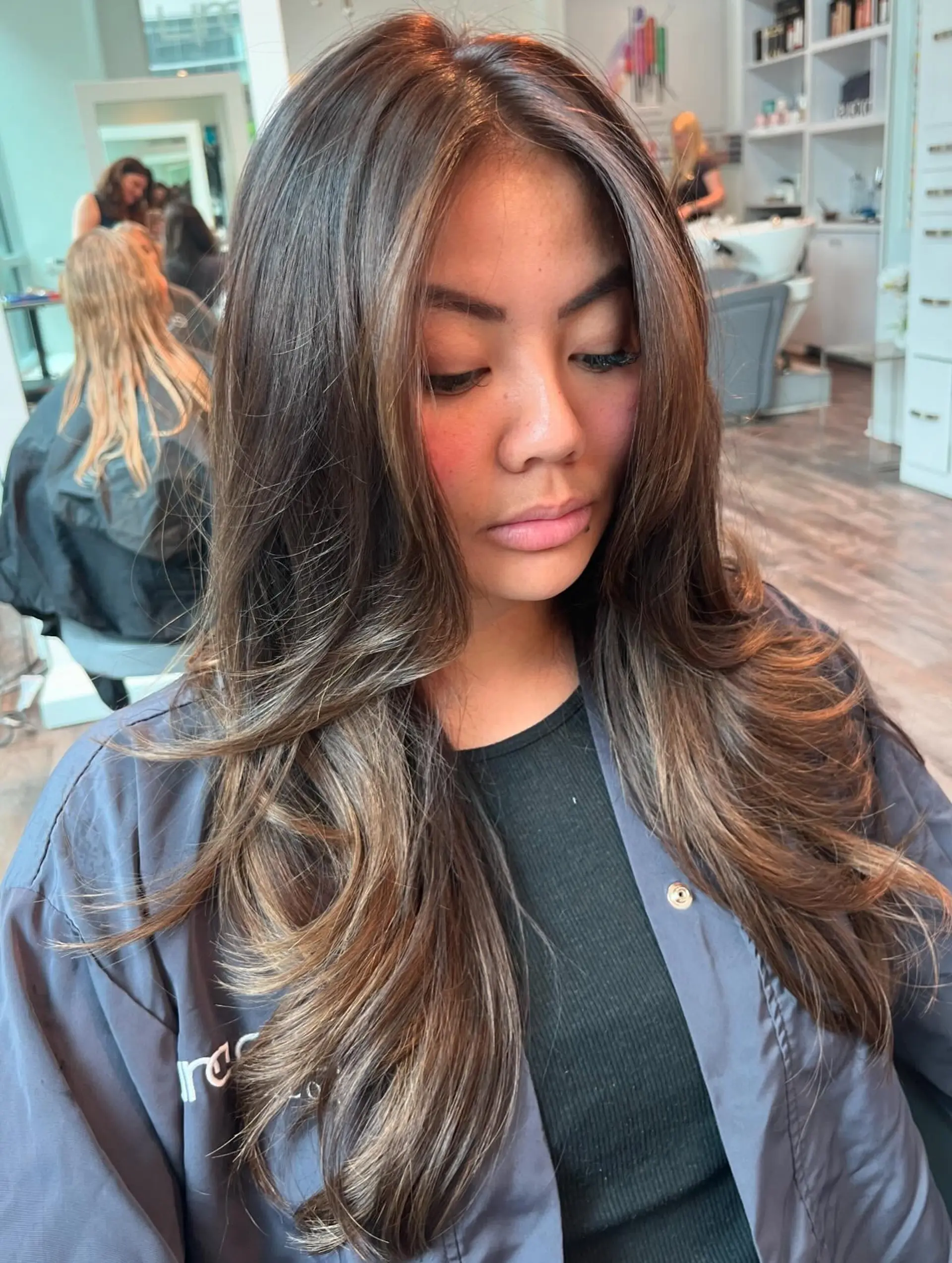 Long wavy hair with a dimensional caramel balayage. 2
