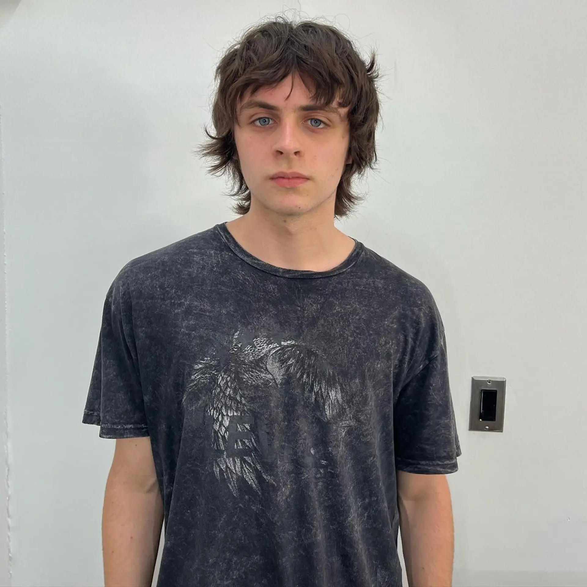 Medium-length brown hair with shaggy layers and a messy fringe, characterized by natural waves and textured volume. 1