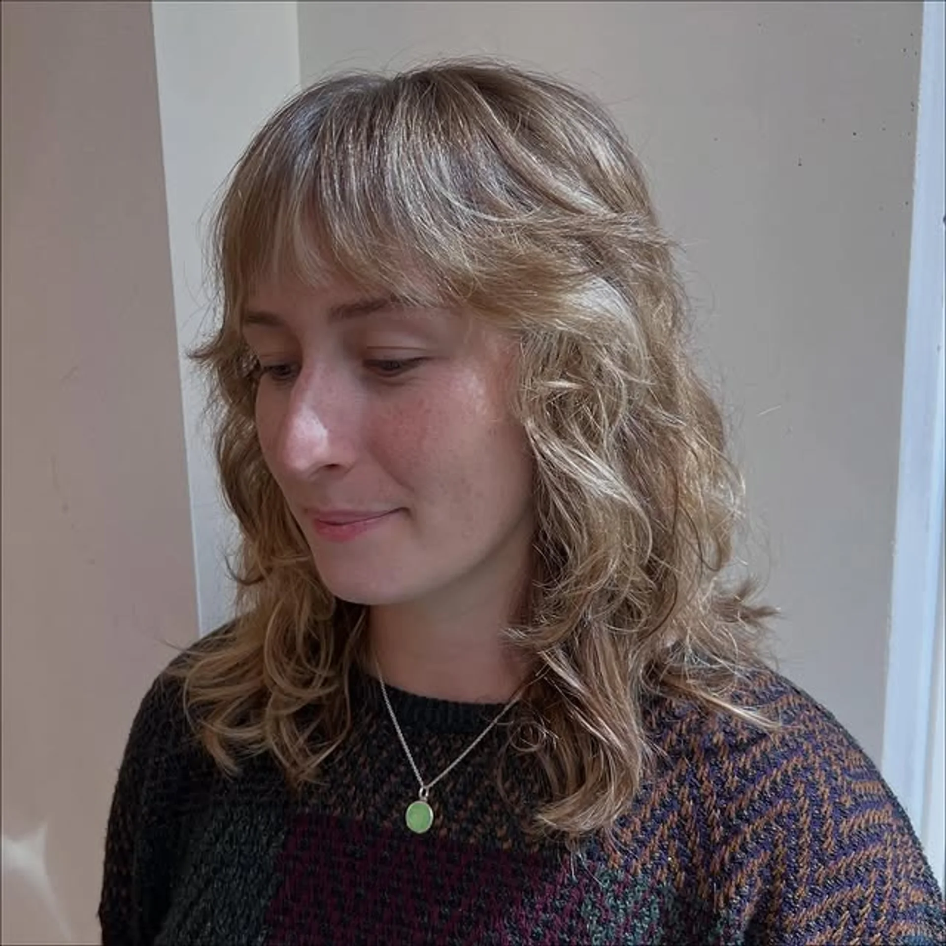 A woman with long, lush wavy dark hair showcasing a healthy, glossy finish, representing San Francisco's 2026 hair trends. - Preview 3