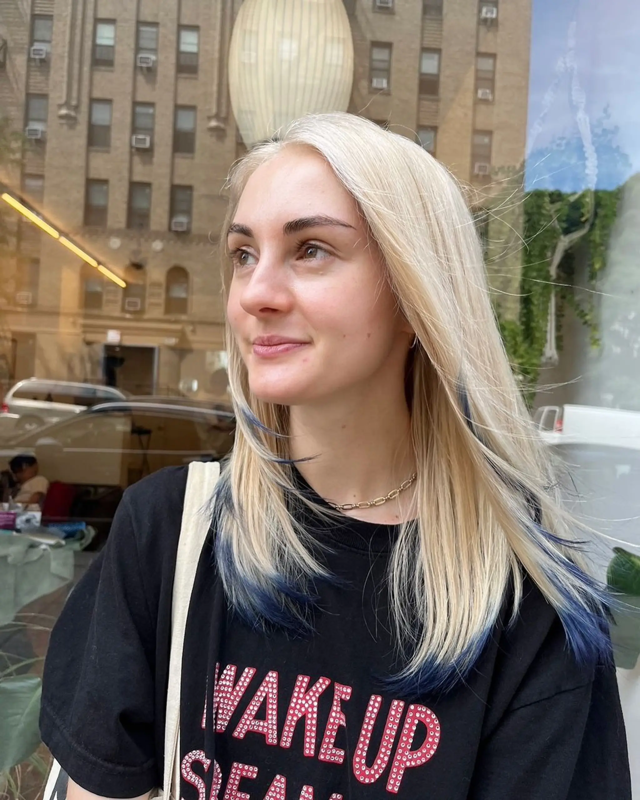 Medium-length, straight platinum blonde hair with dark blue tips, softly parted on the side with natural layers. Hair cut and Color ✨💙by @limi.nyc 