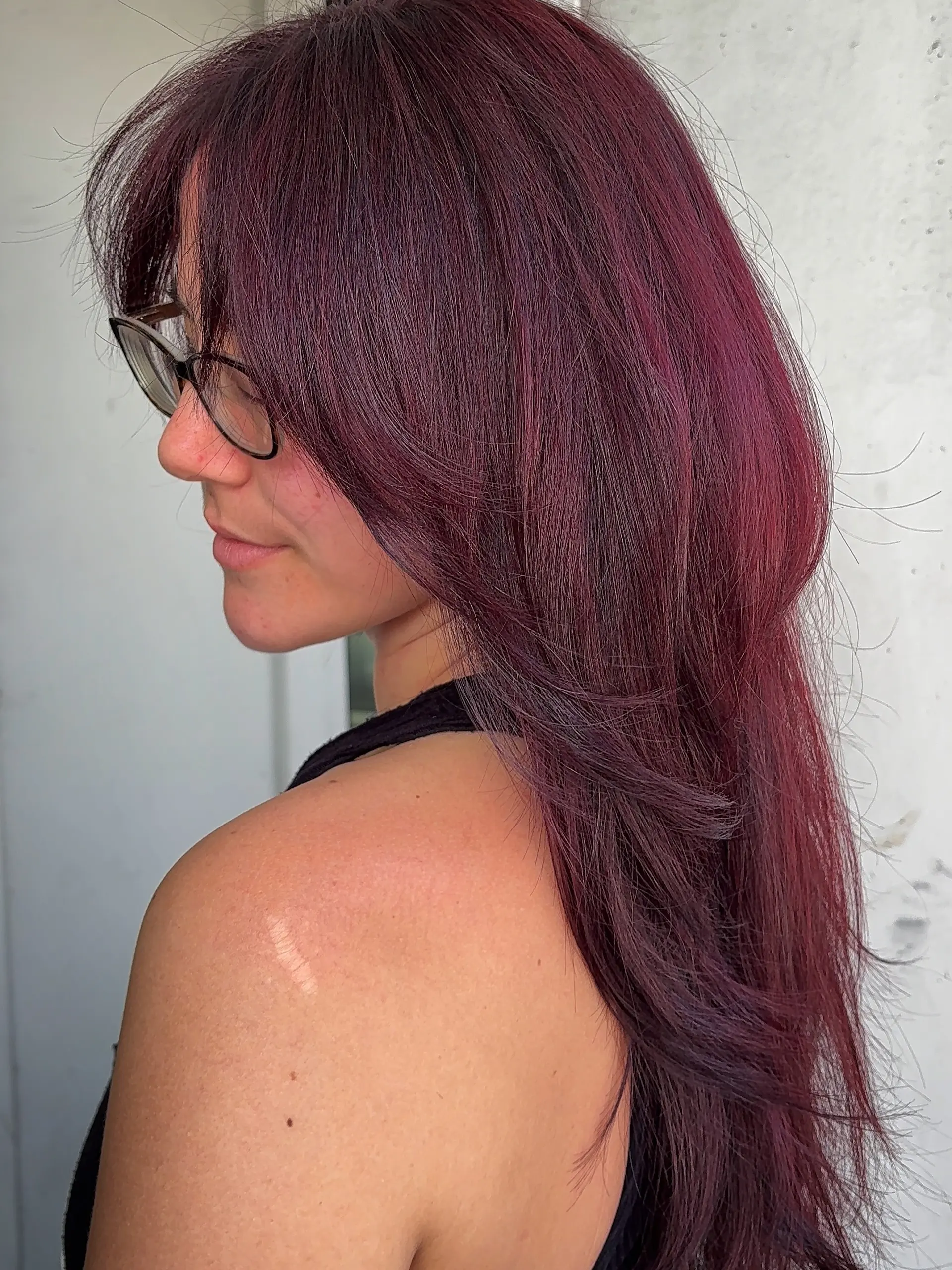 Rich burgundy-toned long hair featuring layered ends and soft face-framing bangs. 1