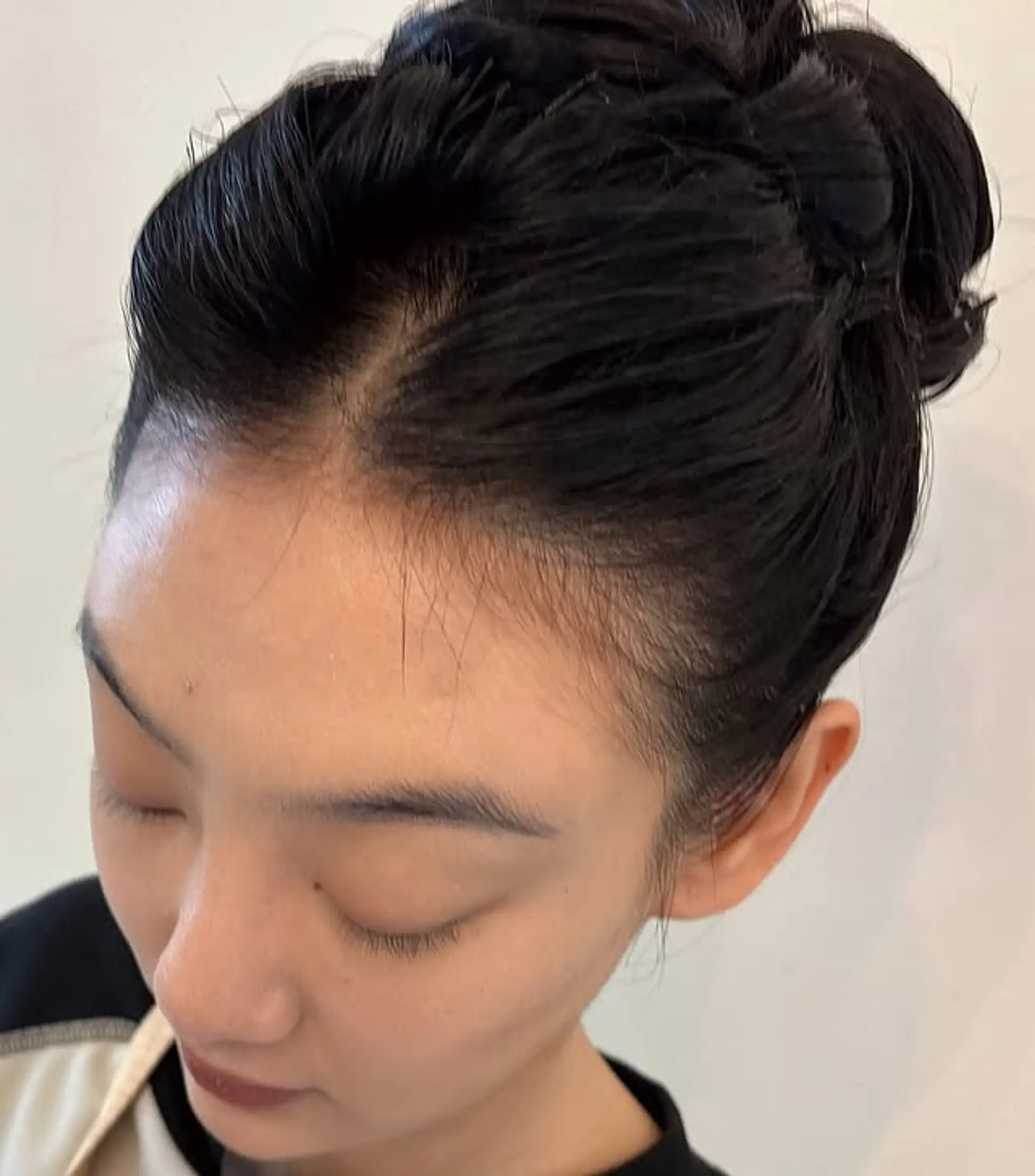 A sleek bun updo with a twisted element. 1