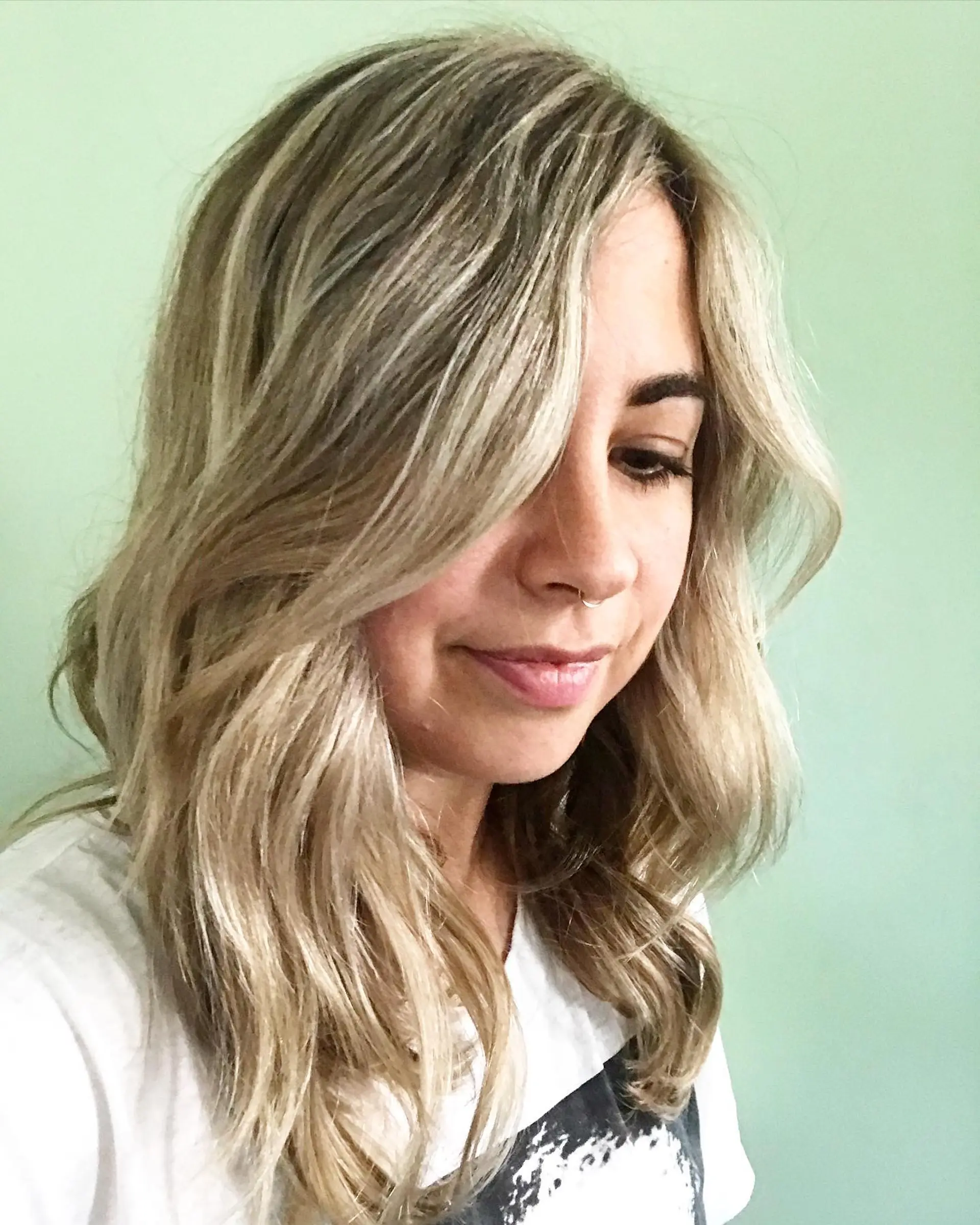 Medium length, wavy hairstyle with beachy waves and blonde balayage. 1