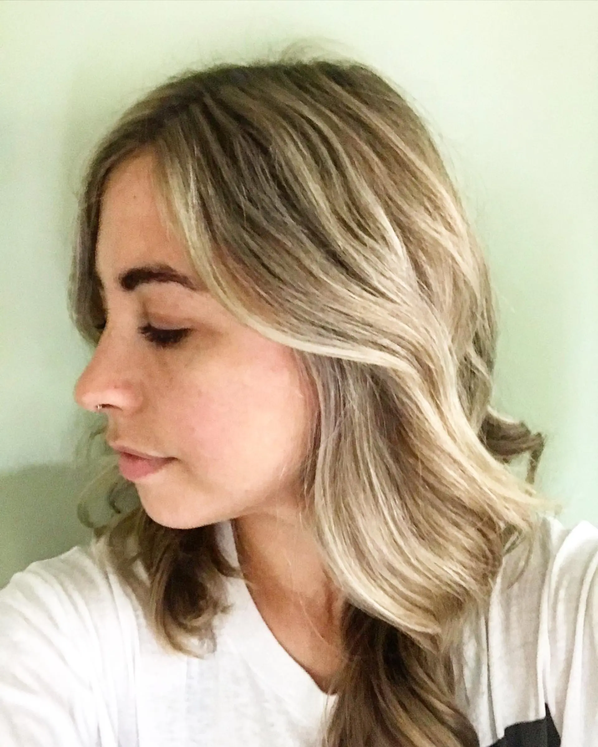 Medium length, wavy hairstyle with beachy waves and blonde balayage. 2
