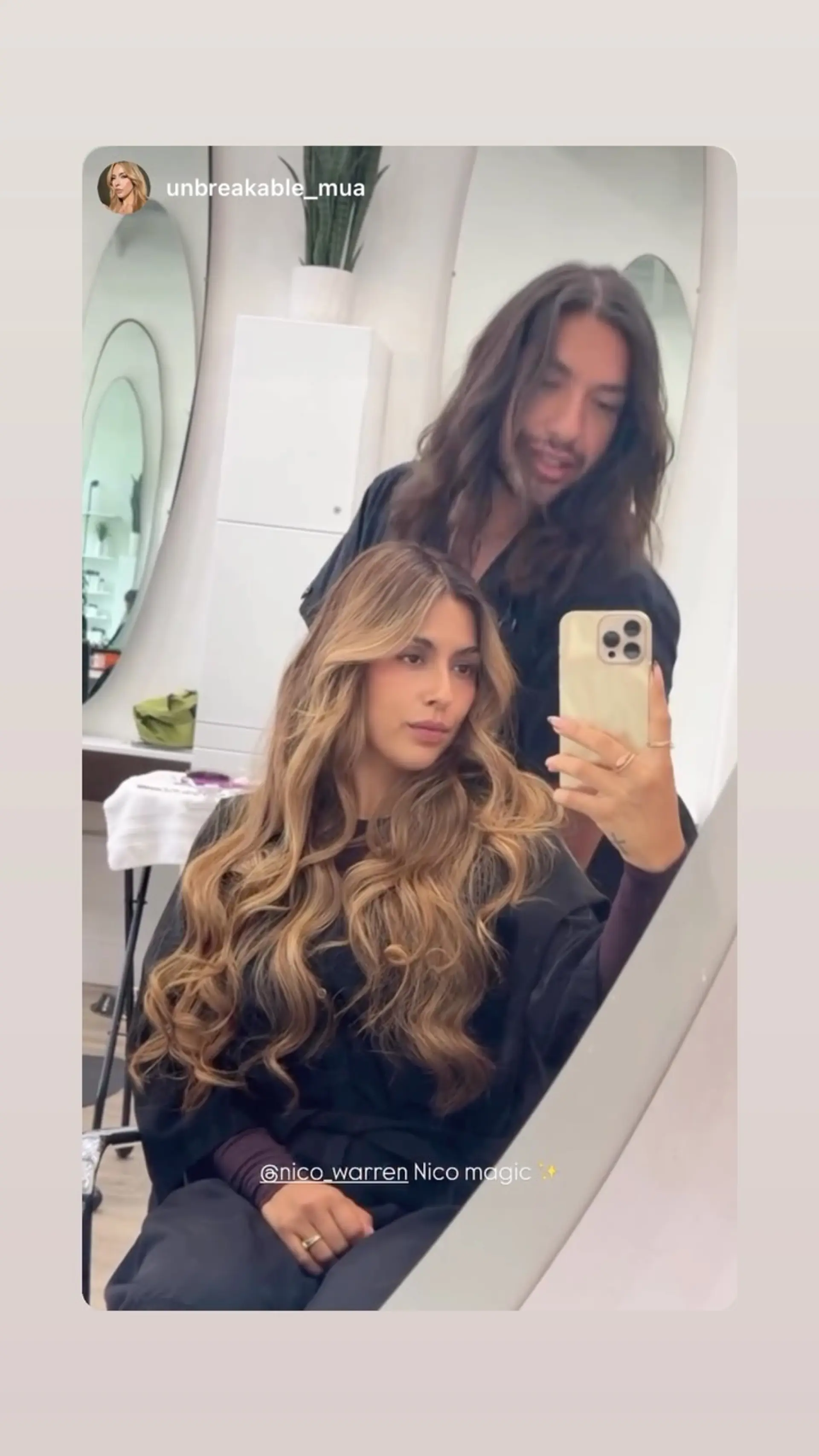 Extra-long hair styled in voluminous, polished waves with warm honey and caramel balayage highlights. 1