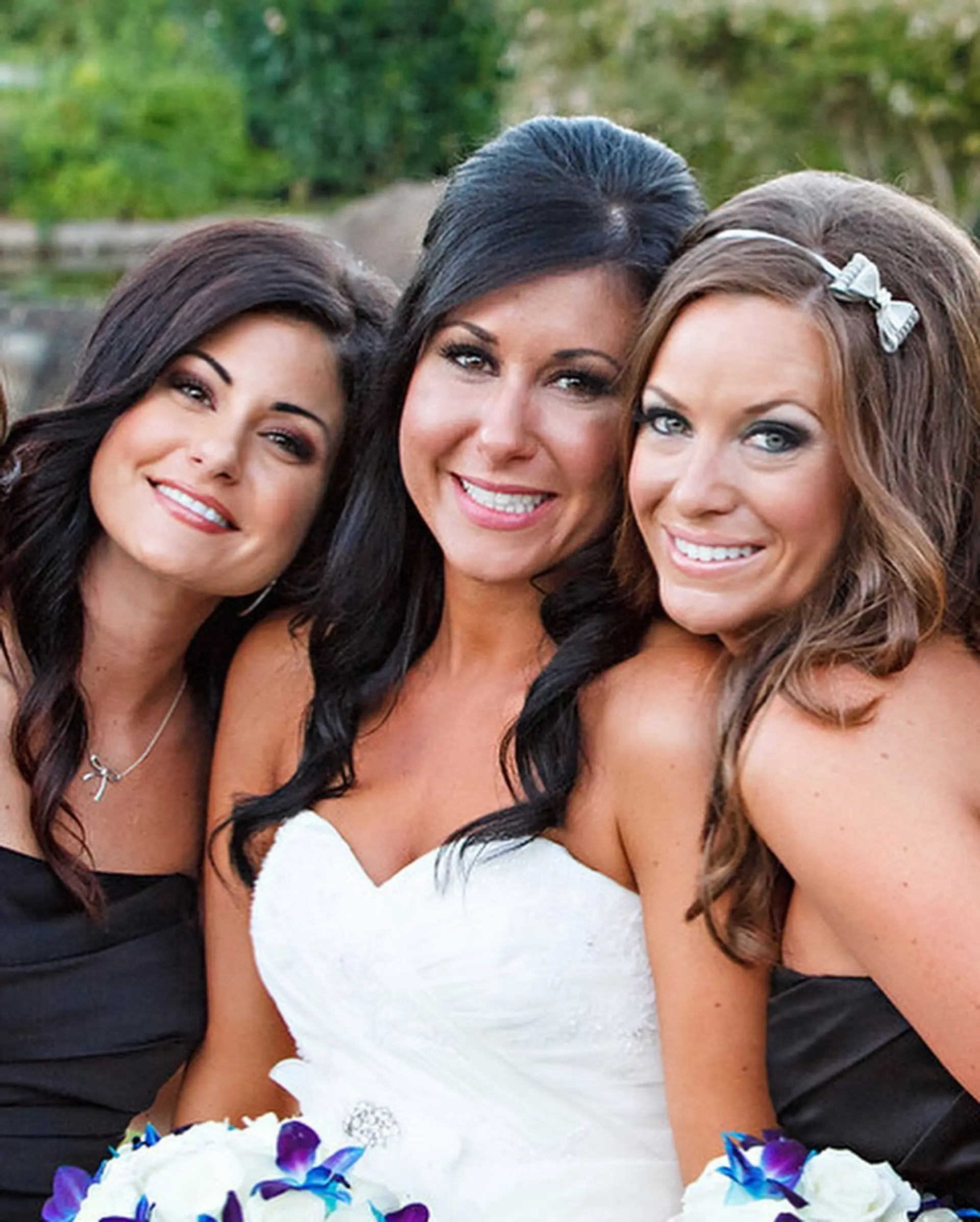 Elegant wedding hair styling featuring voluminous half-up dos, soft curls, and side-swept fringe. 1