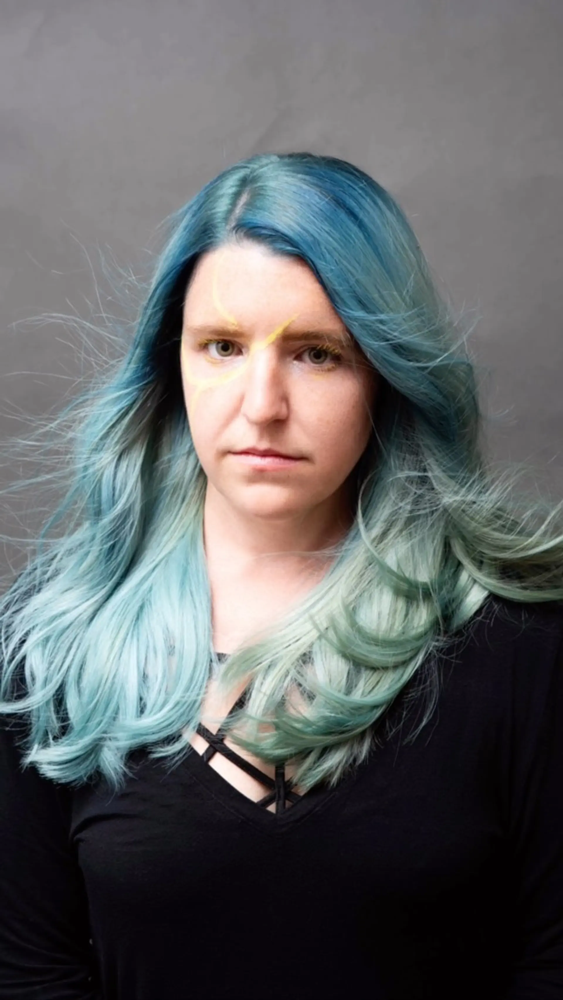 Long layered waves featuring a vivid color melt from a dusty teal root into soft mint and pastel aqua ends. 1