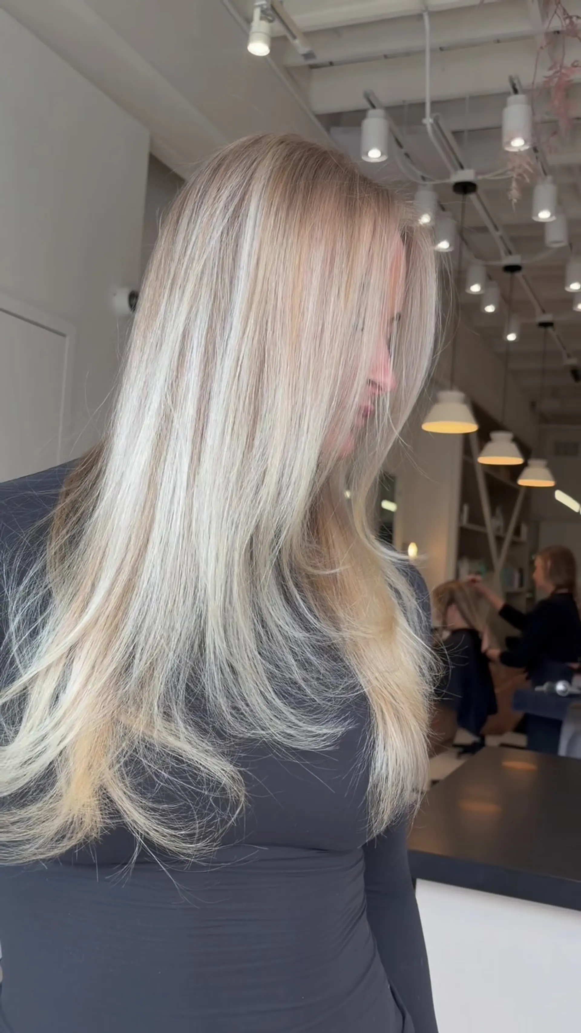 Long vanilla blonde hair styled straight with soft, textured face-framing layers. 1
