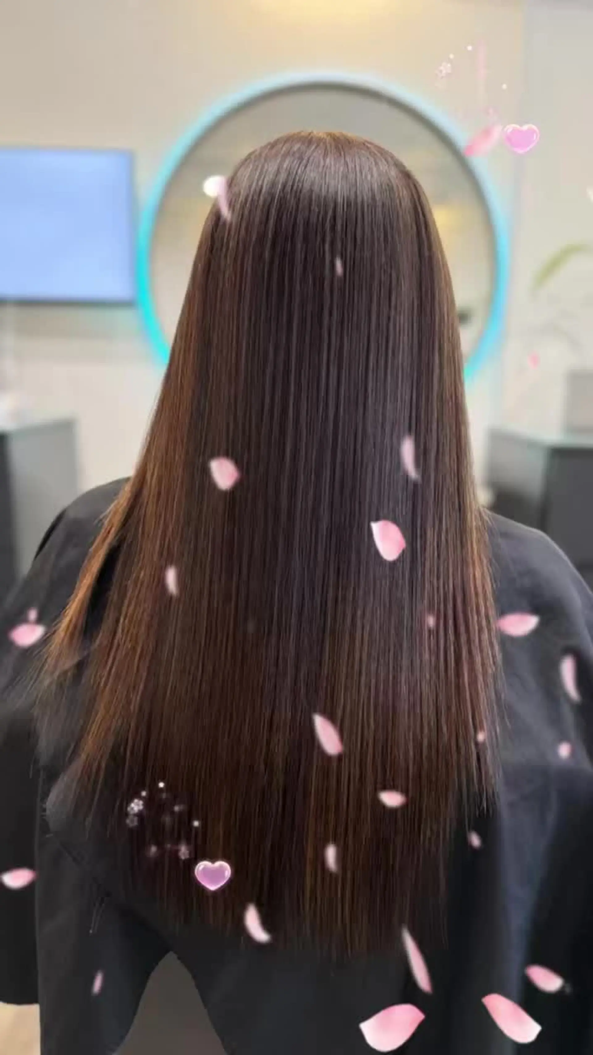 A sleek, pin-straight hairstyle cascading down the back with an ultra-smooth, glass-like finish in rich brunette tones. 1