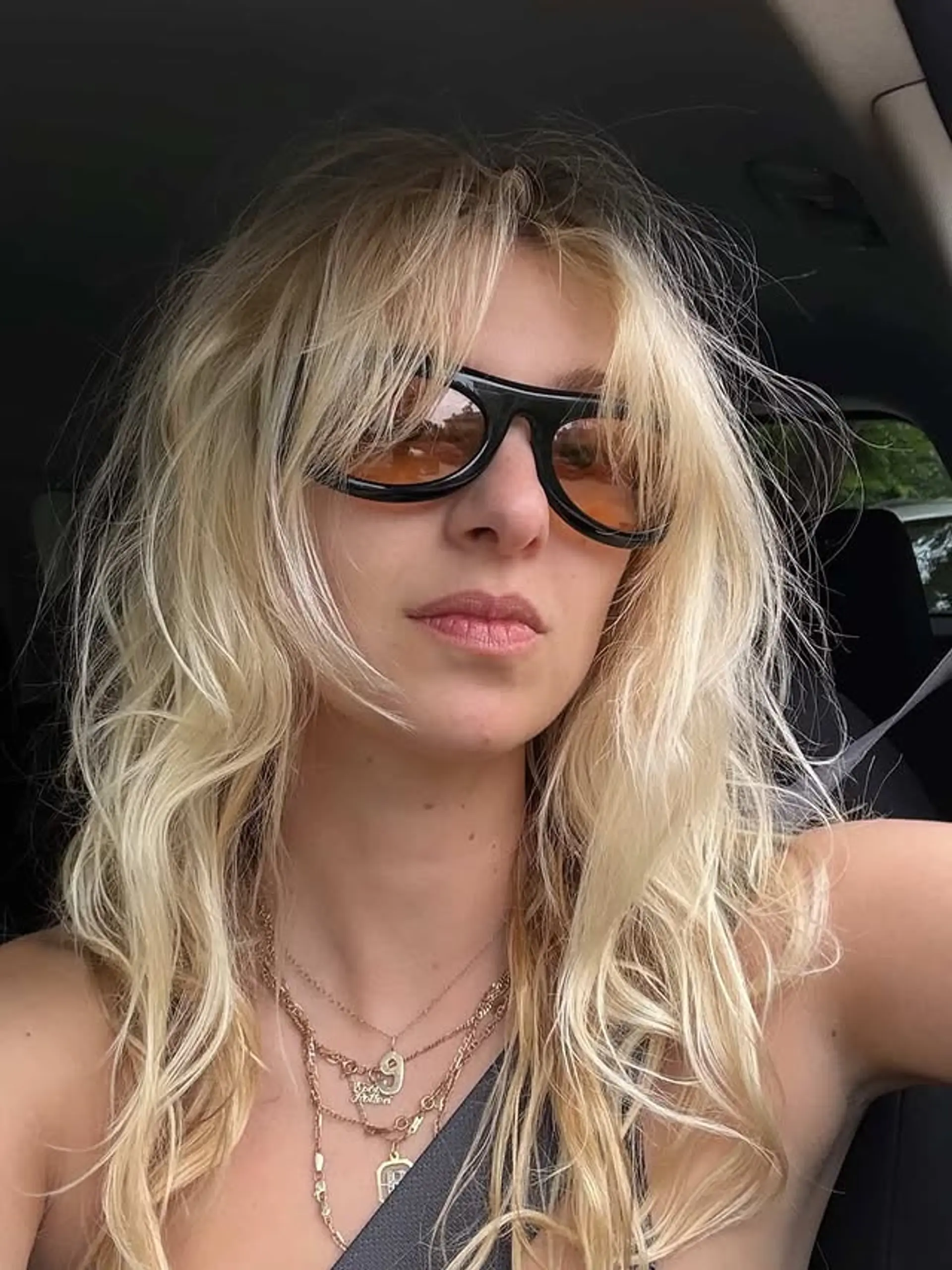 A layered shag with beachy waves and curtain bangs. 1