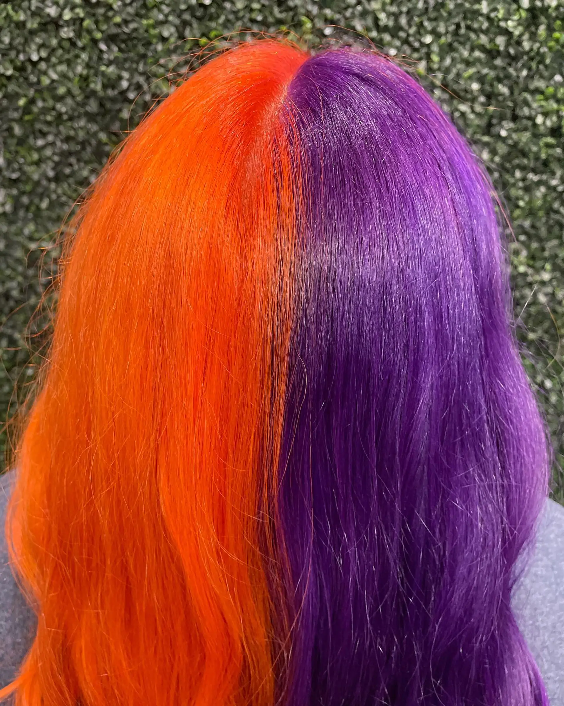 A bold split-dye color featuring electric orange on one half and deep vibrant purple on the other. 1