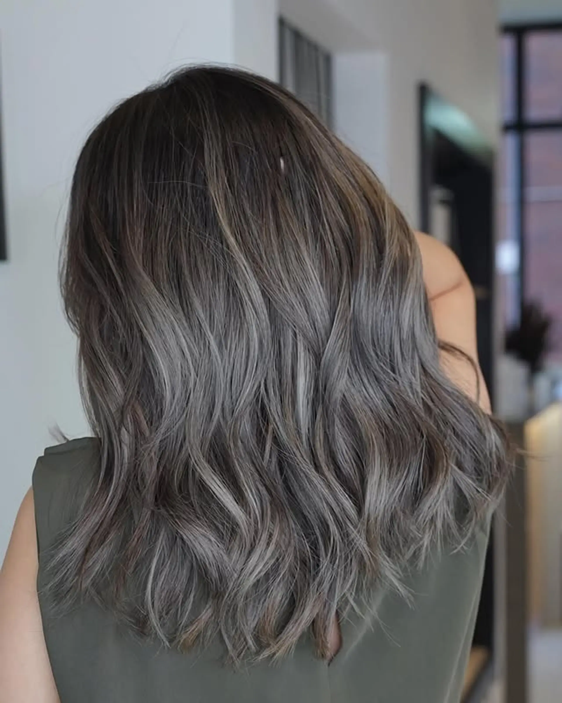 Medium length wavy hair with a silver ash balayage. 1