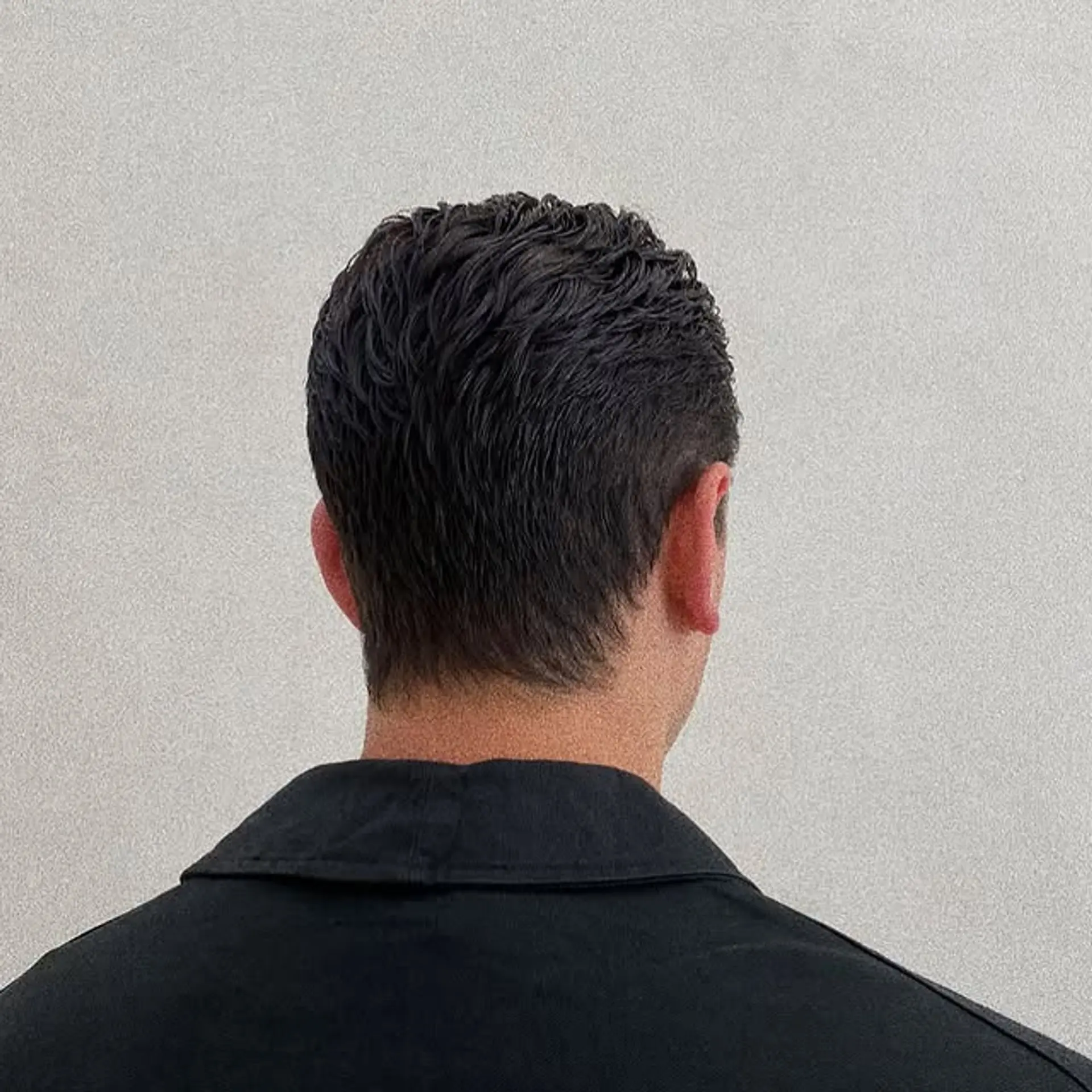 A textured crop with tapered sides and natural waves. 1