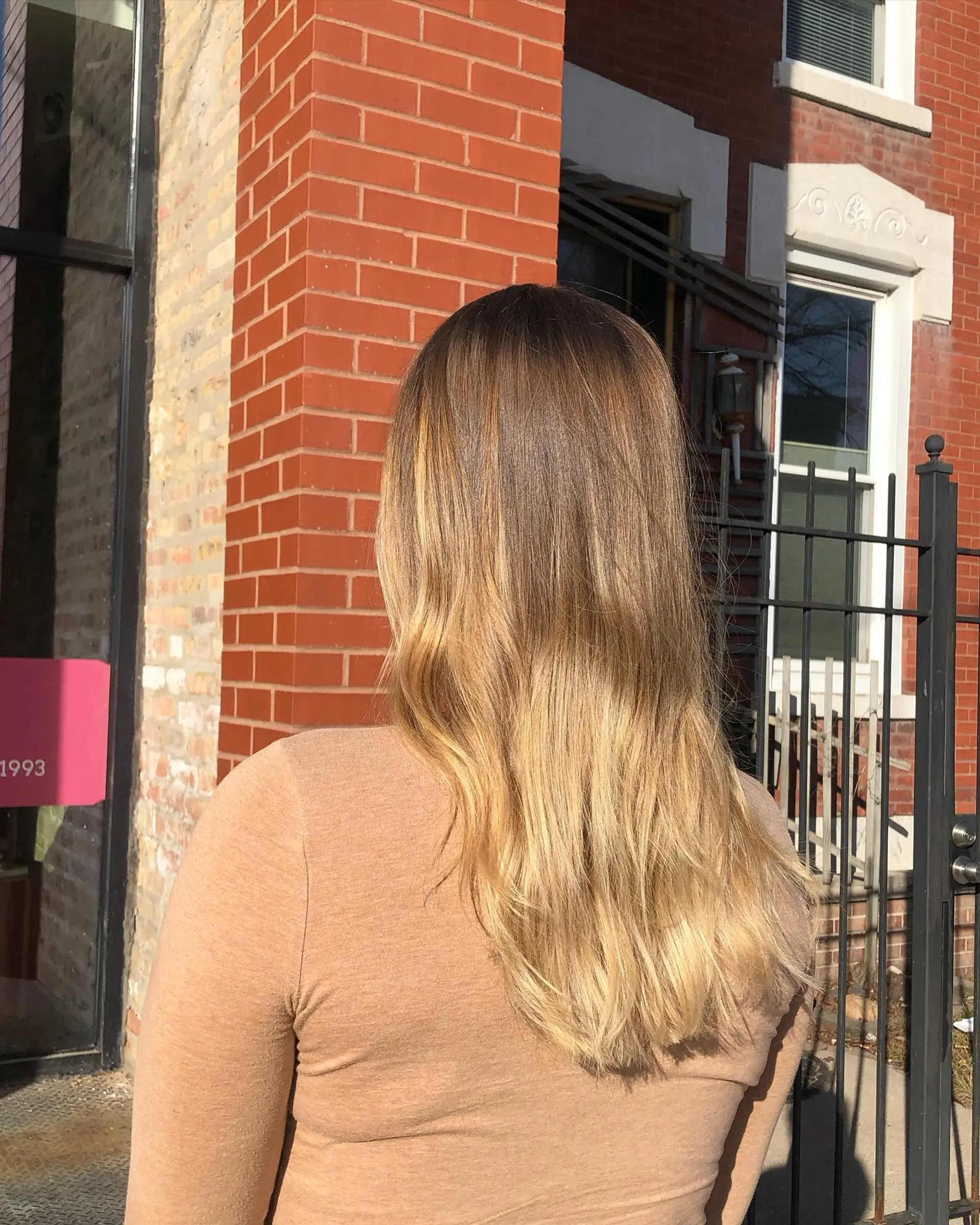 A long, wavy hairstyle with a beautiful caramel blonde balayage. 1