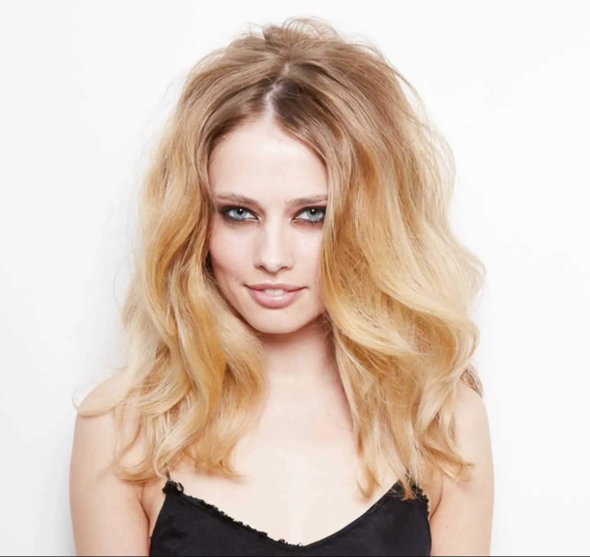 Medium-length wavy hair with an ombre color effect. 1