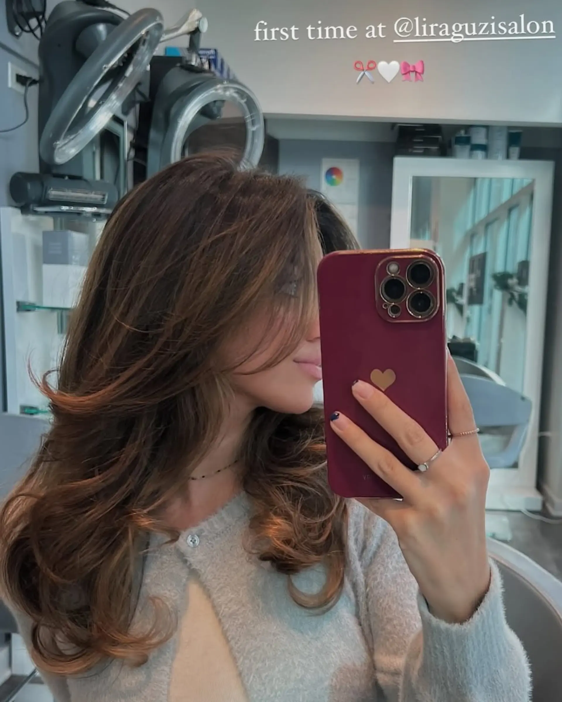 A long layered haircut with face-framing layers and a soft, wavy texture. 1