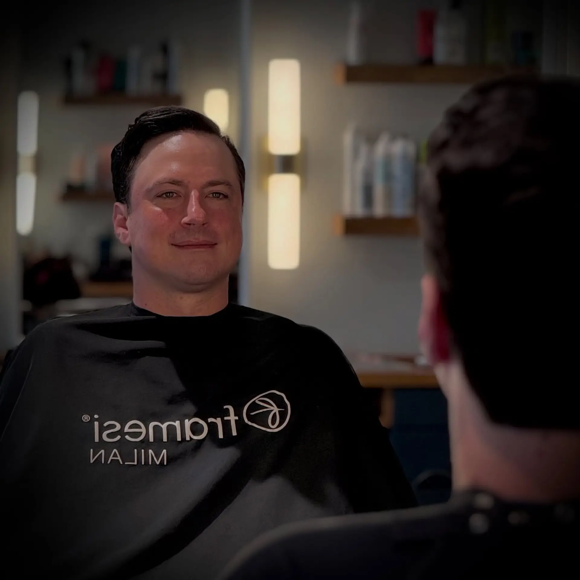 A tailored men's short haircut styled neatly to the side with a natural, polished finish. 1