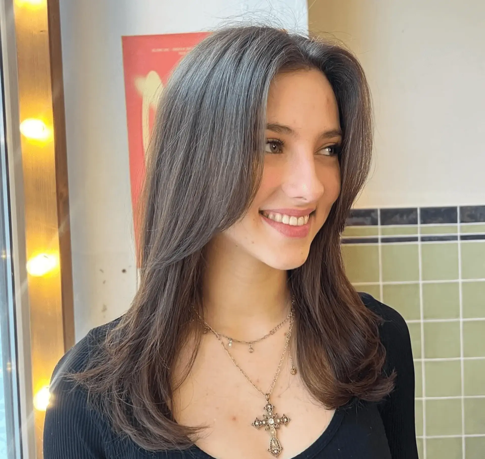 Beautifully crafted medium-length hairstyle with straight, dark brown hair styled into classic, elegant layers with a middle part, showcasing soft volume and natural shine. 1