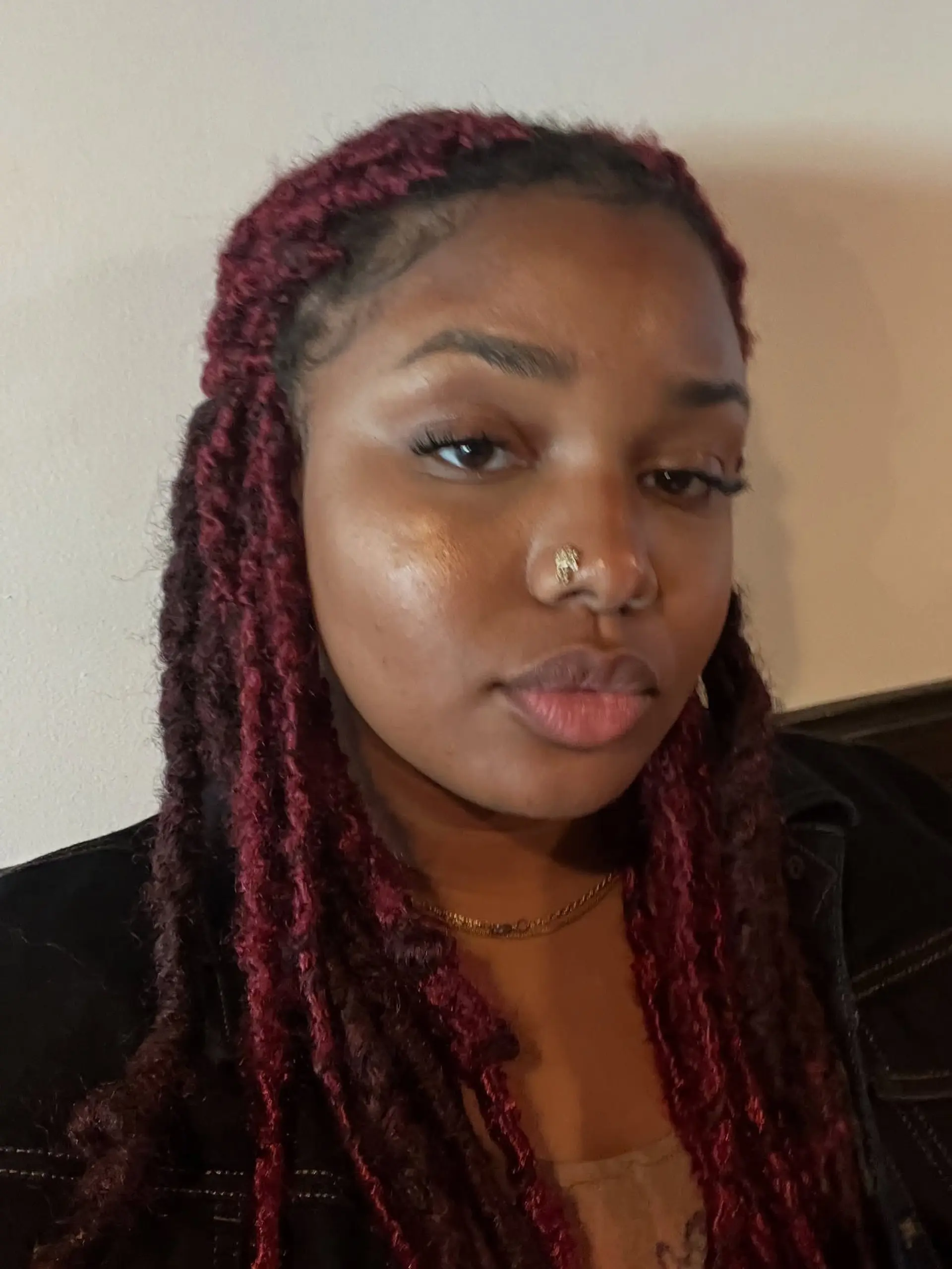 Shoulder- to chest-length textured faux locs in a rich burgundy tone. 1
