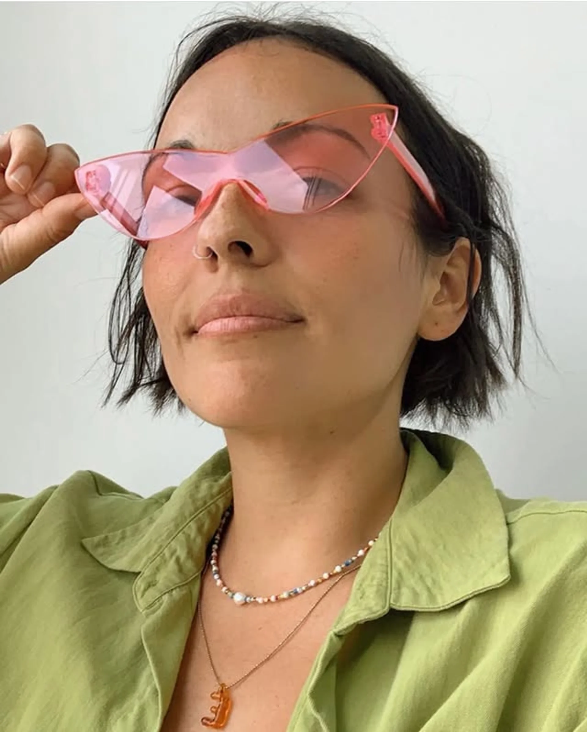 A chic bob haircut with wavy texture, dark brown base color, and ash brown highlights, layered for volume and movement. - Preview 2