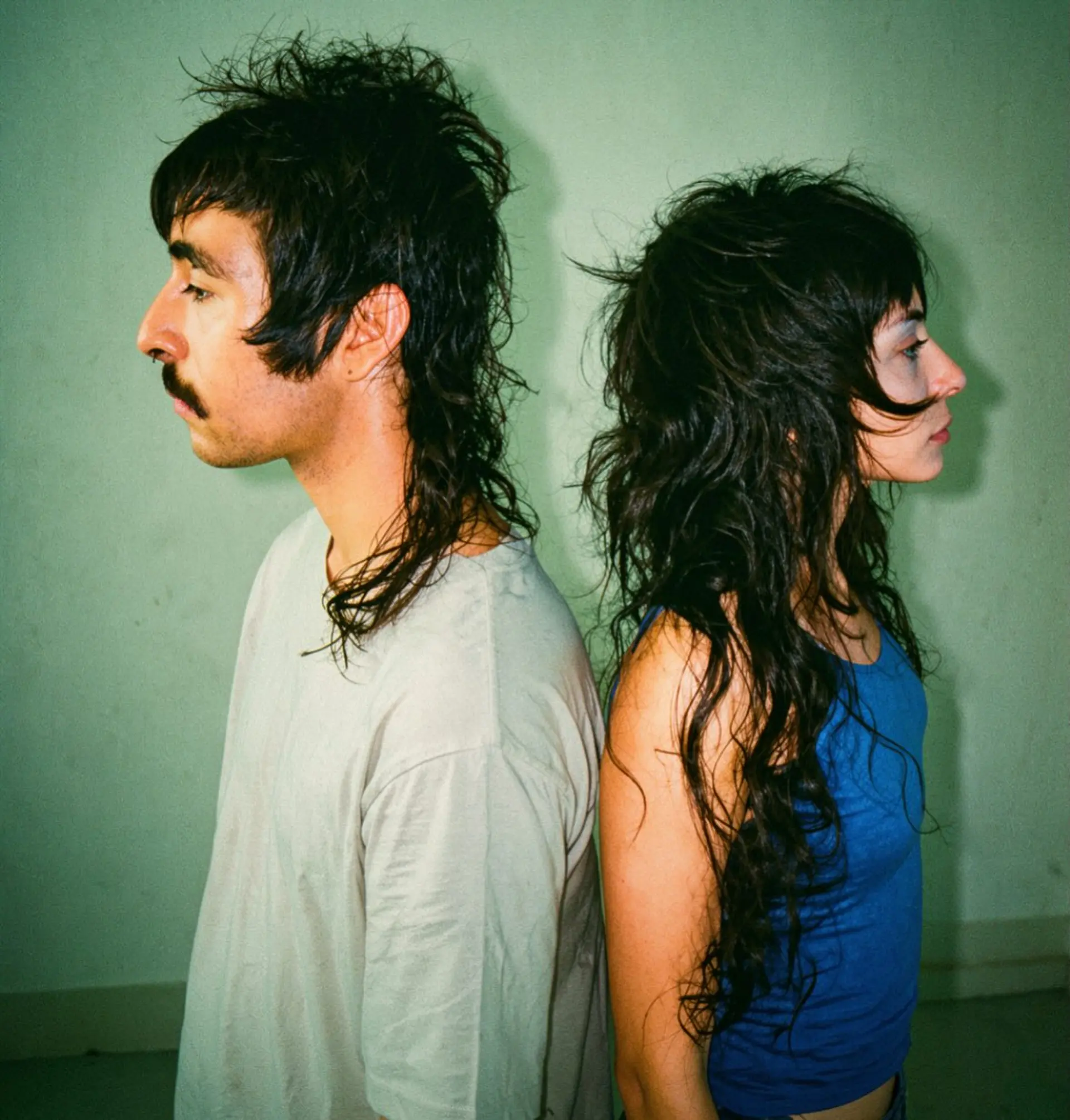 Heavily layered mullet shag haircuts featuring textured bangs, crown volume, and long, piecey lengths. 1