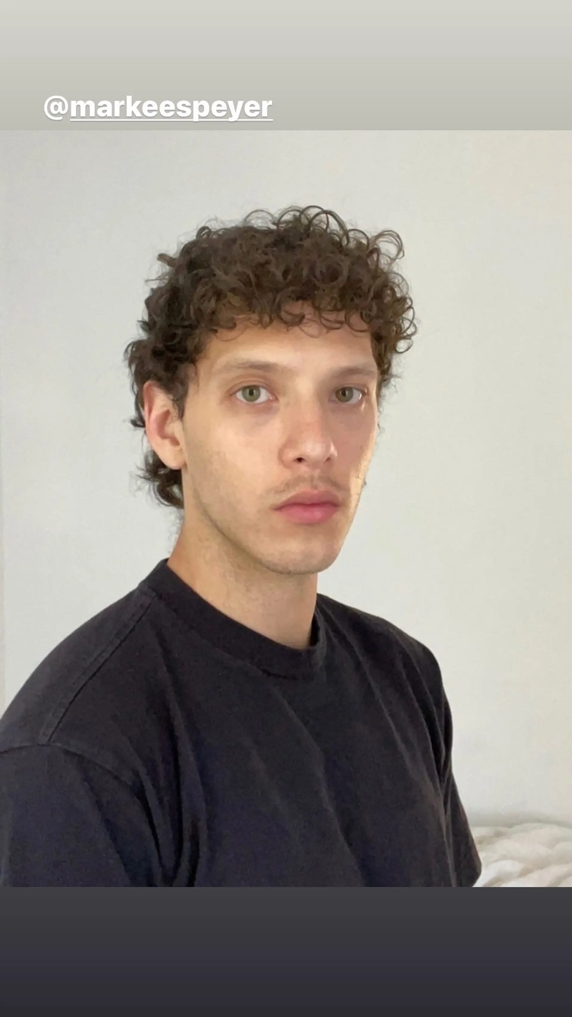 A modern take on the classic mullet with curly hair and a shag cut. 1