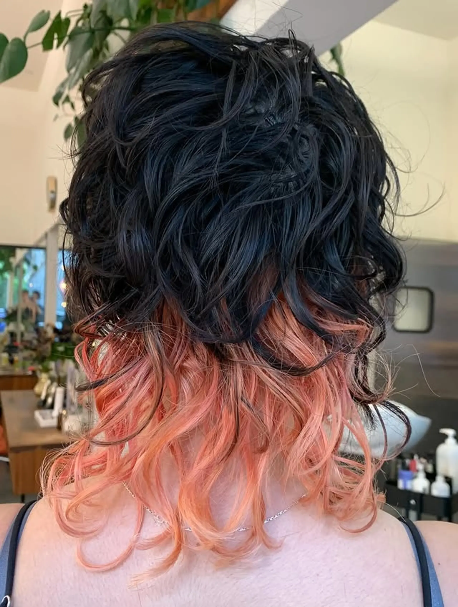 A wavy lob with a dark base and coral highlights. 1