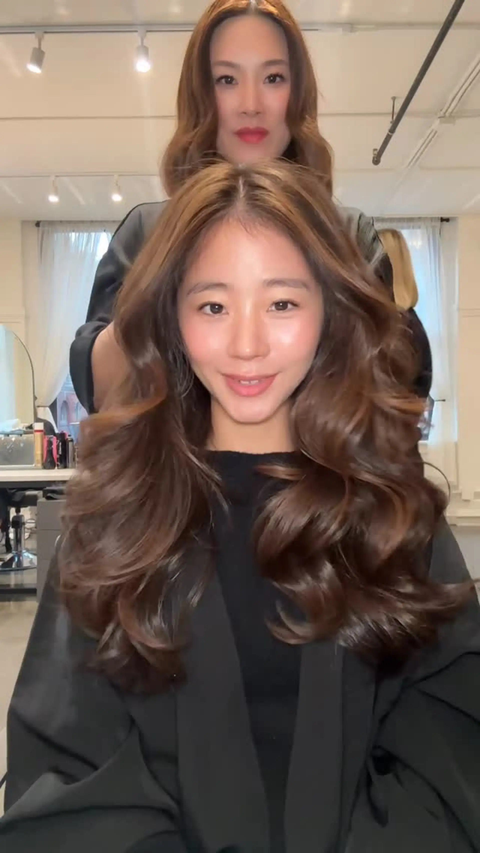 Voluminous long chocolate brown hair styled with glossy, flowing waves and subtle dimensional balayage highlights. 1