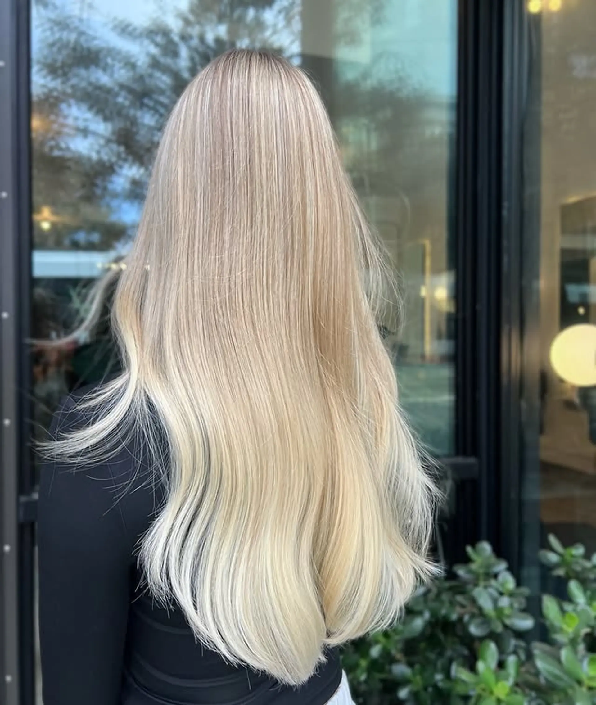Long, straight hair with platinum blonde balayage. 1
