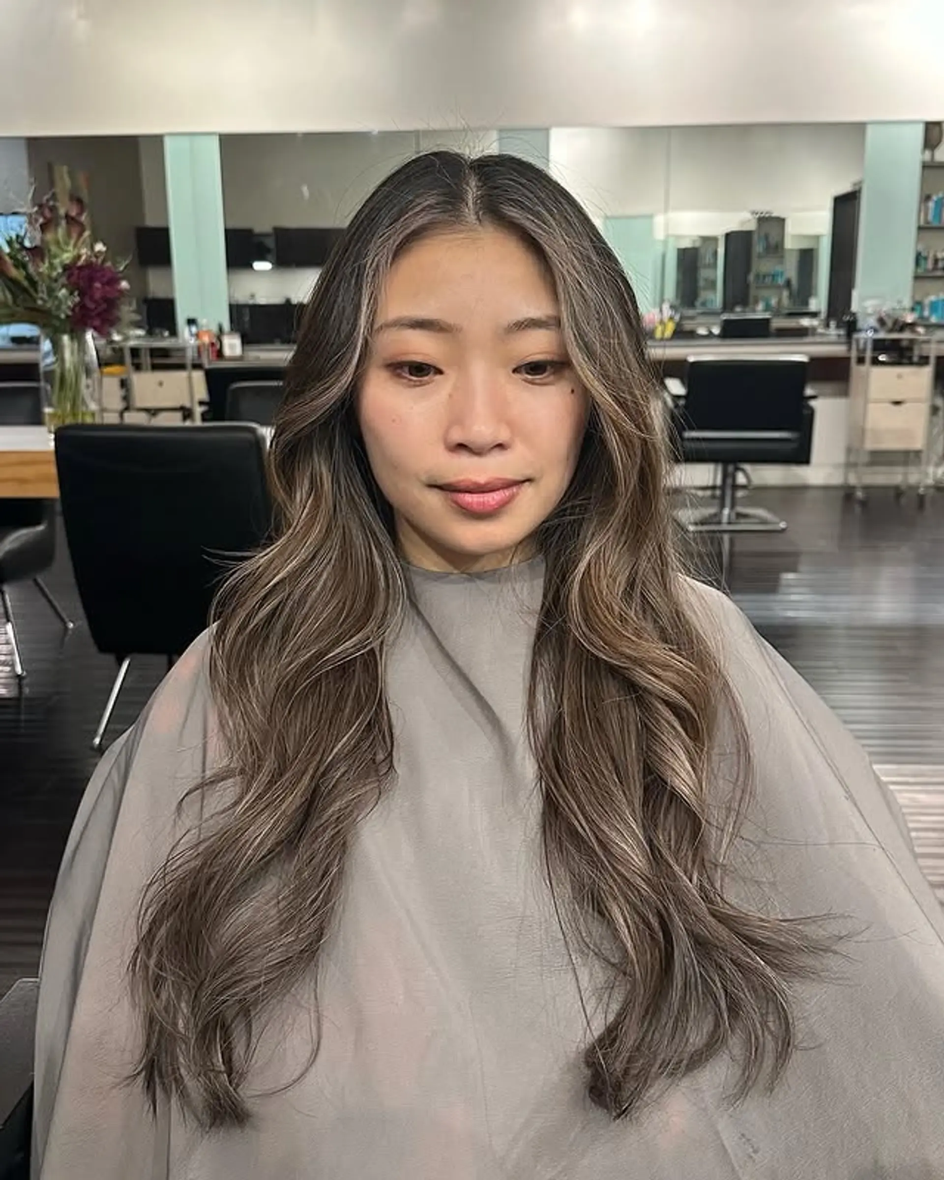 Long wavy hair with an ash blonde balayage. 1