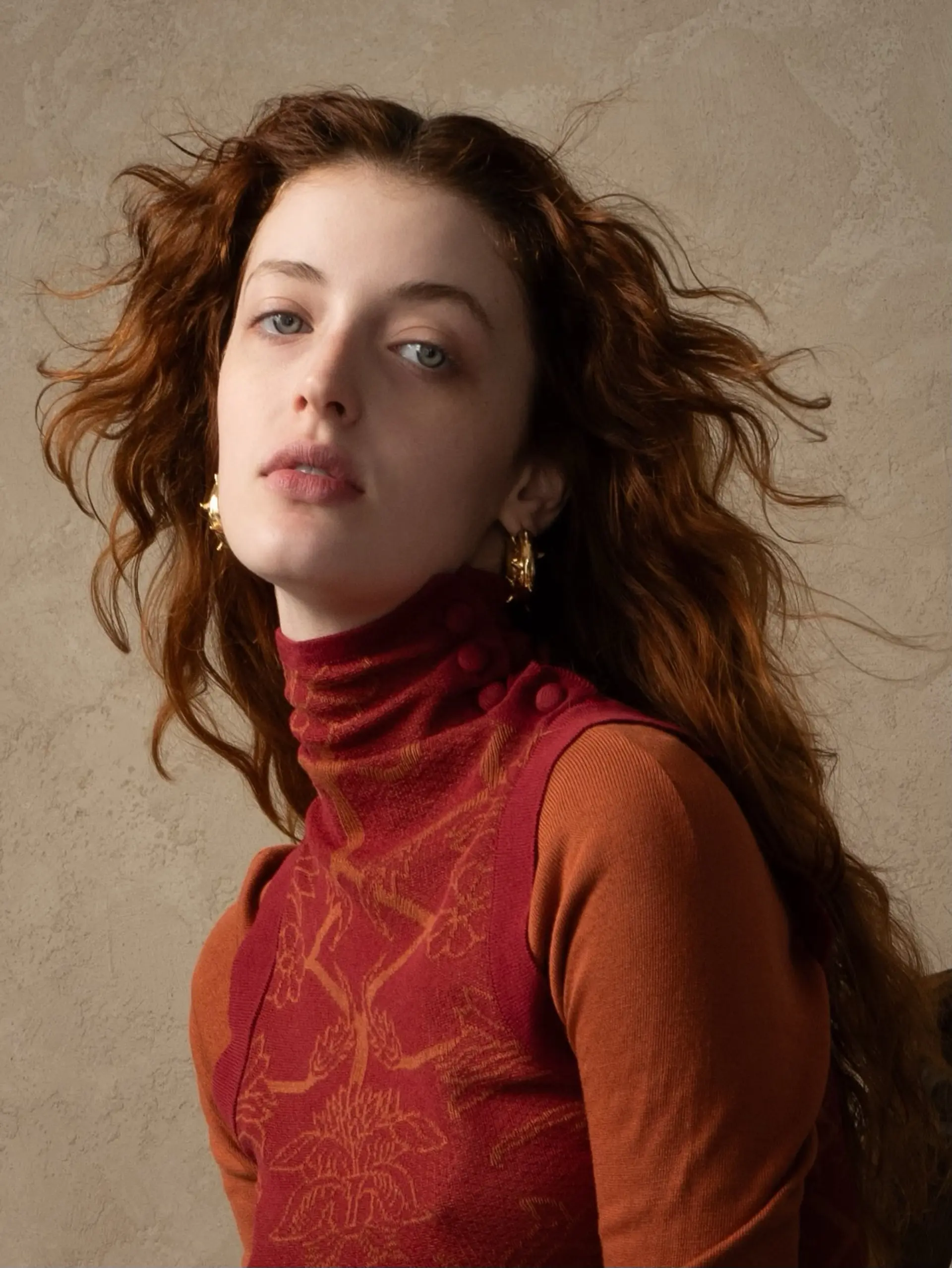 Long, flowing auburn hair styled into airy, windswept natural waves with textured layers. 1