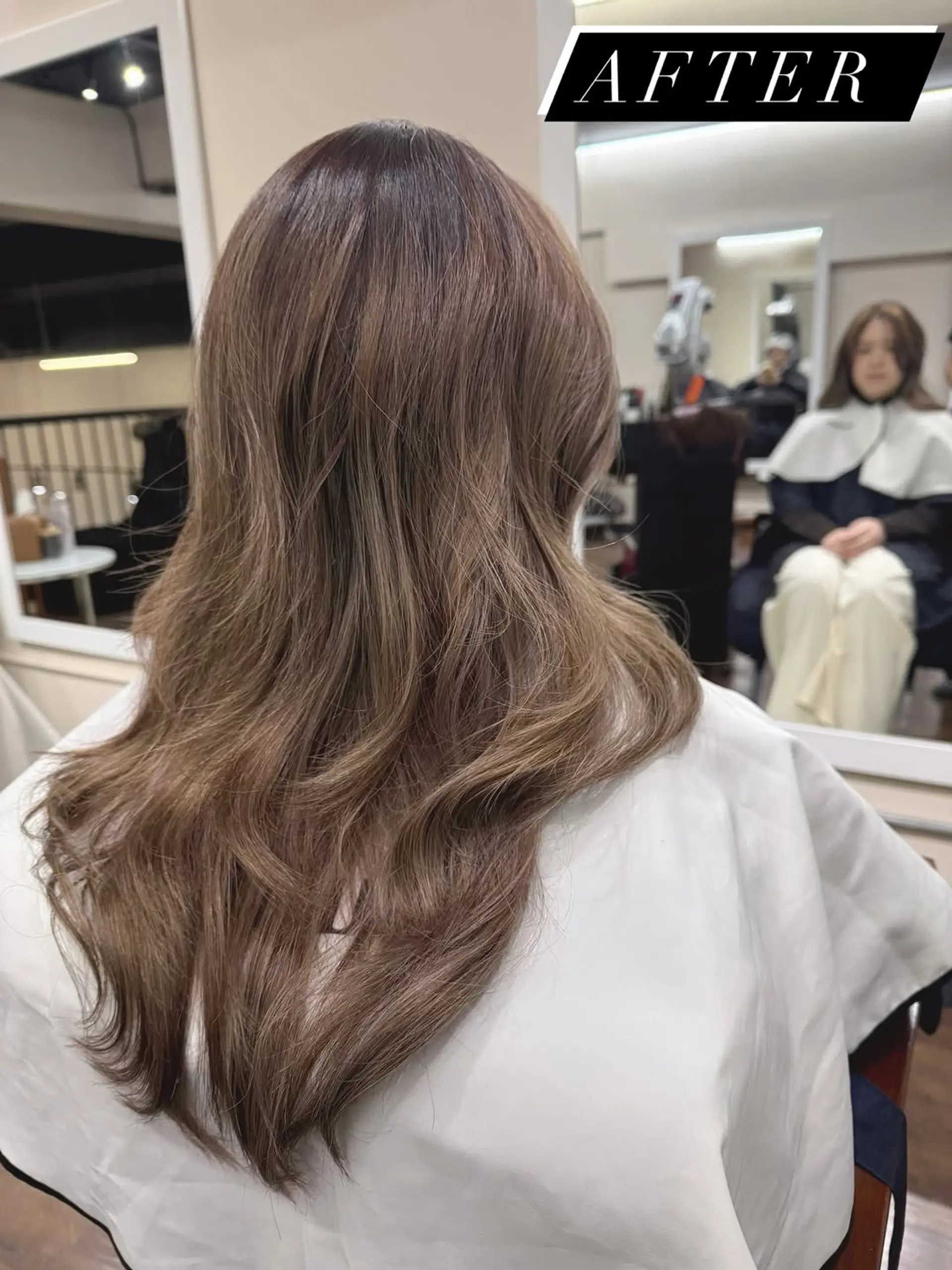 A long, layered cut featuring soft, cascading waves and blended layers that provide natural movement and texture while maintaining overall length. 1