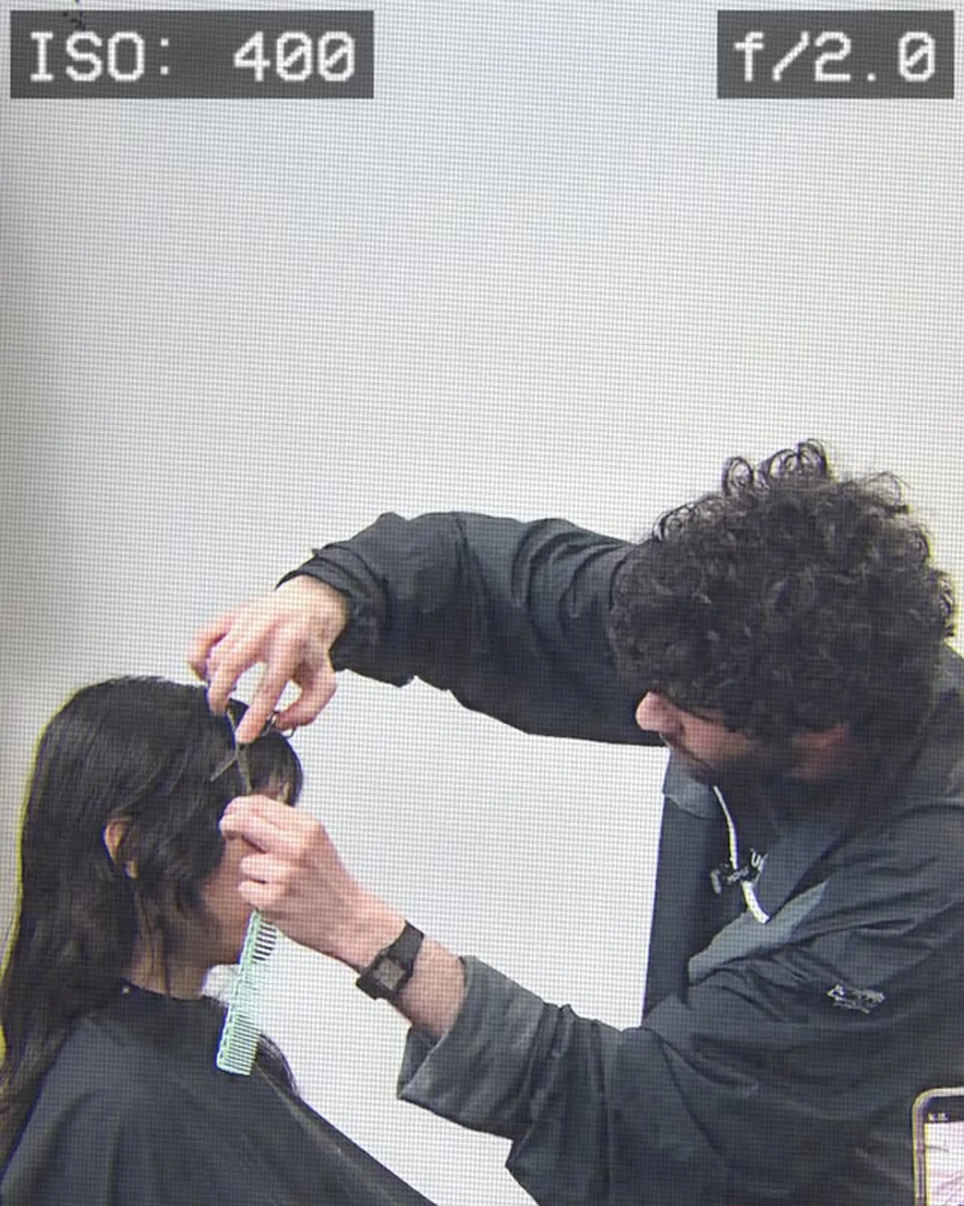 A modern layered shag with face-framing curtain bangs, perfect for adding volume and texture to wavy hair. 1