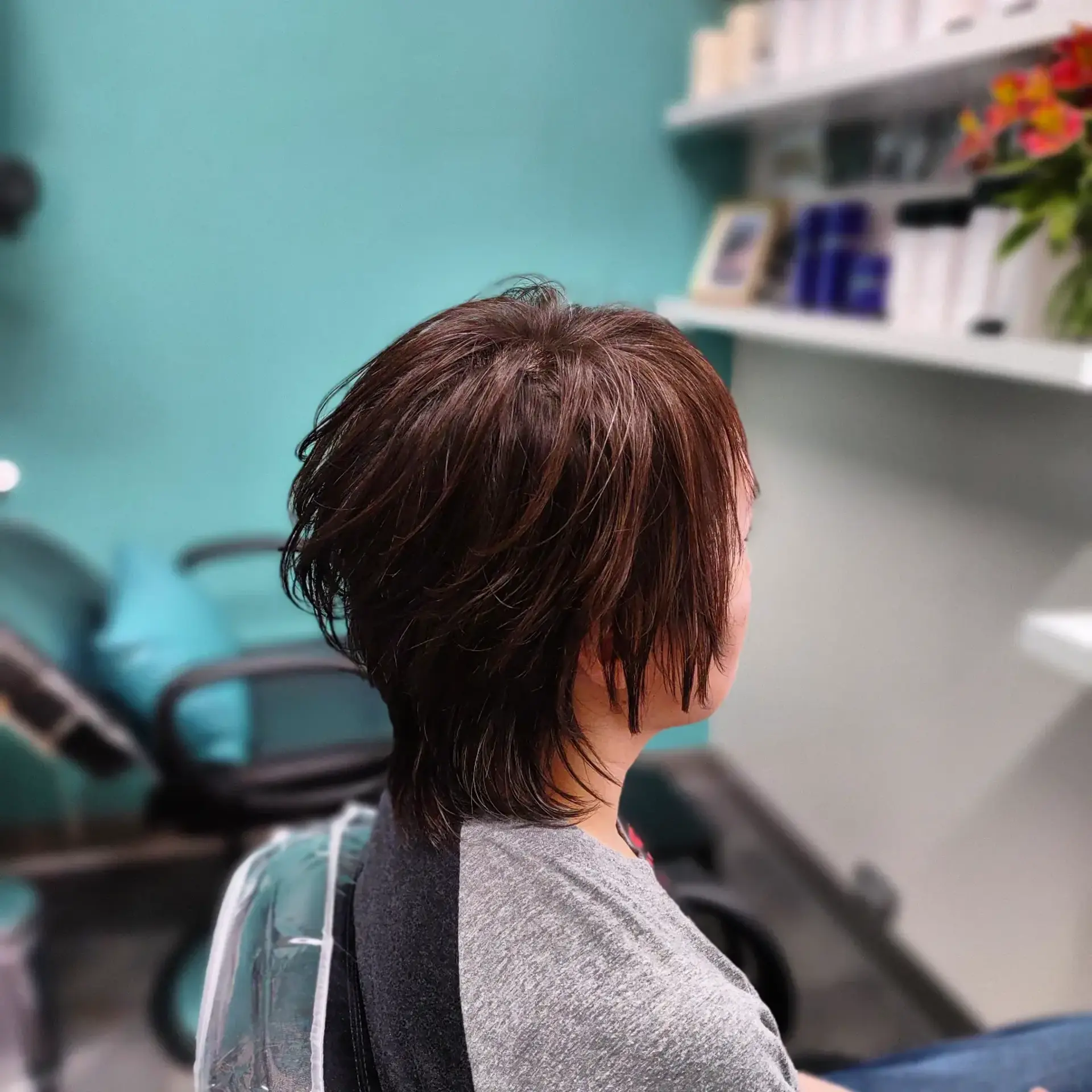 A textured short shag haircut featuring wispy, piecey layers and soft length at the nape. 1
