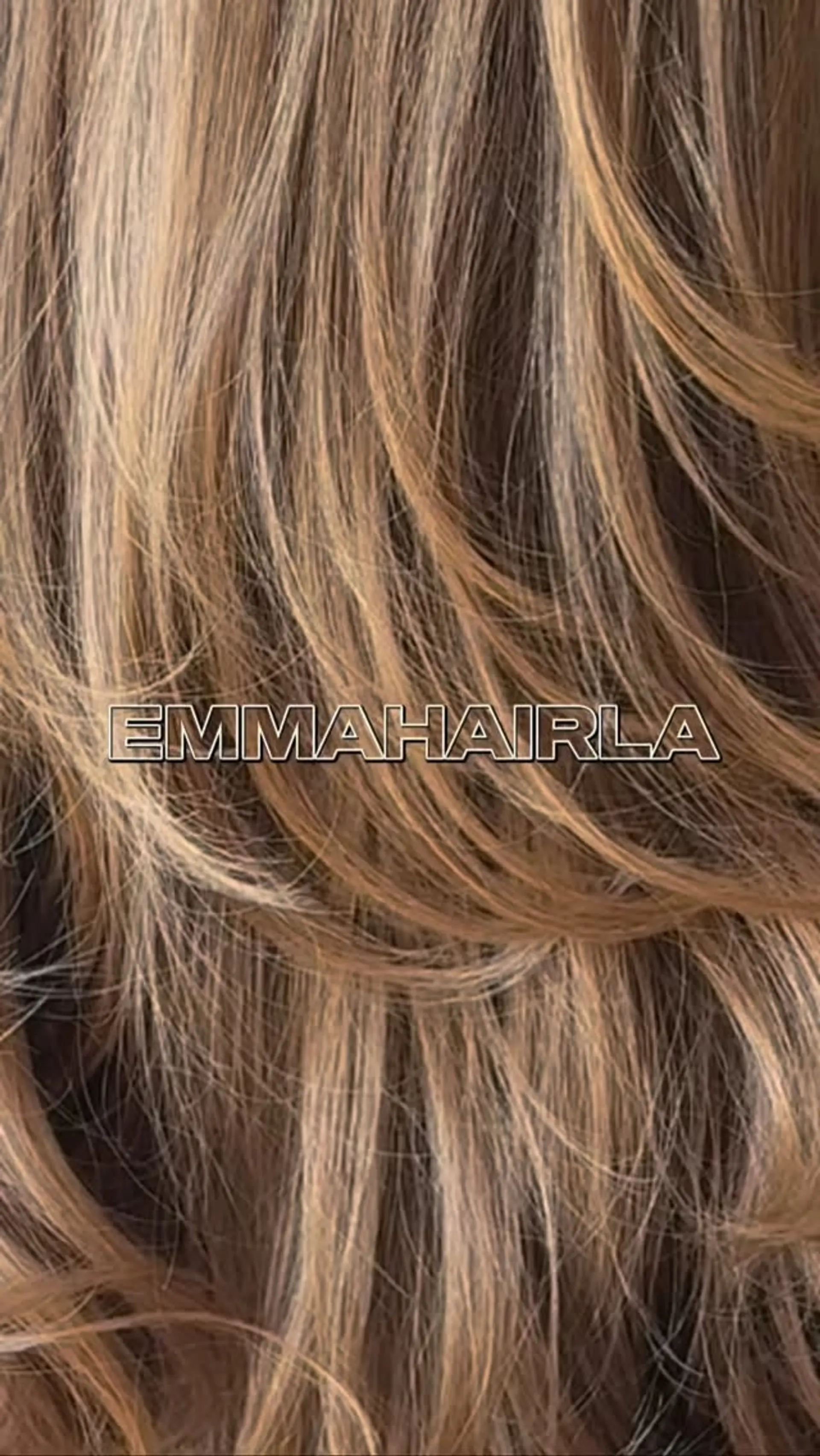 Feathered, cascading layers styled with a soft blowout that accentuates warm, dimensional blonde highlights. 1