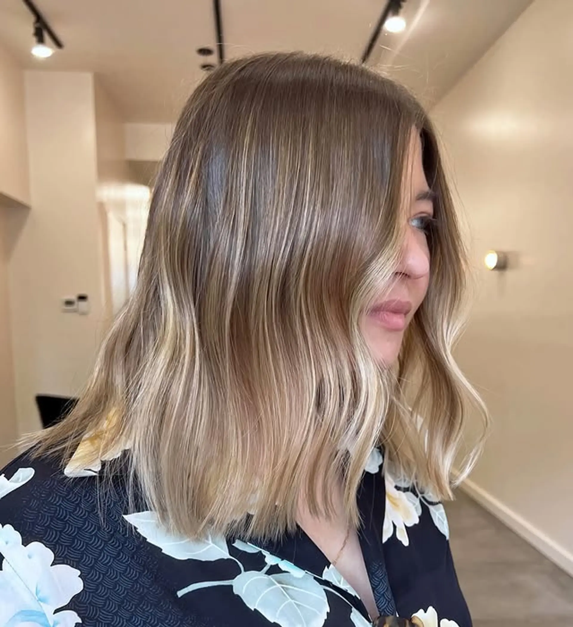 Bronde lob with soft beach waves and a seamless color melt. 1