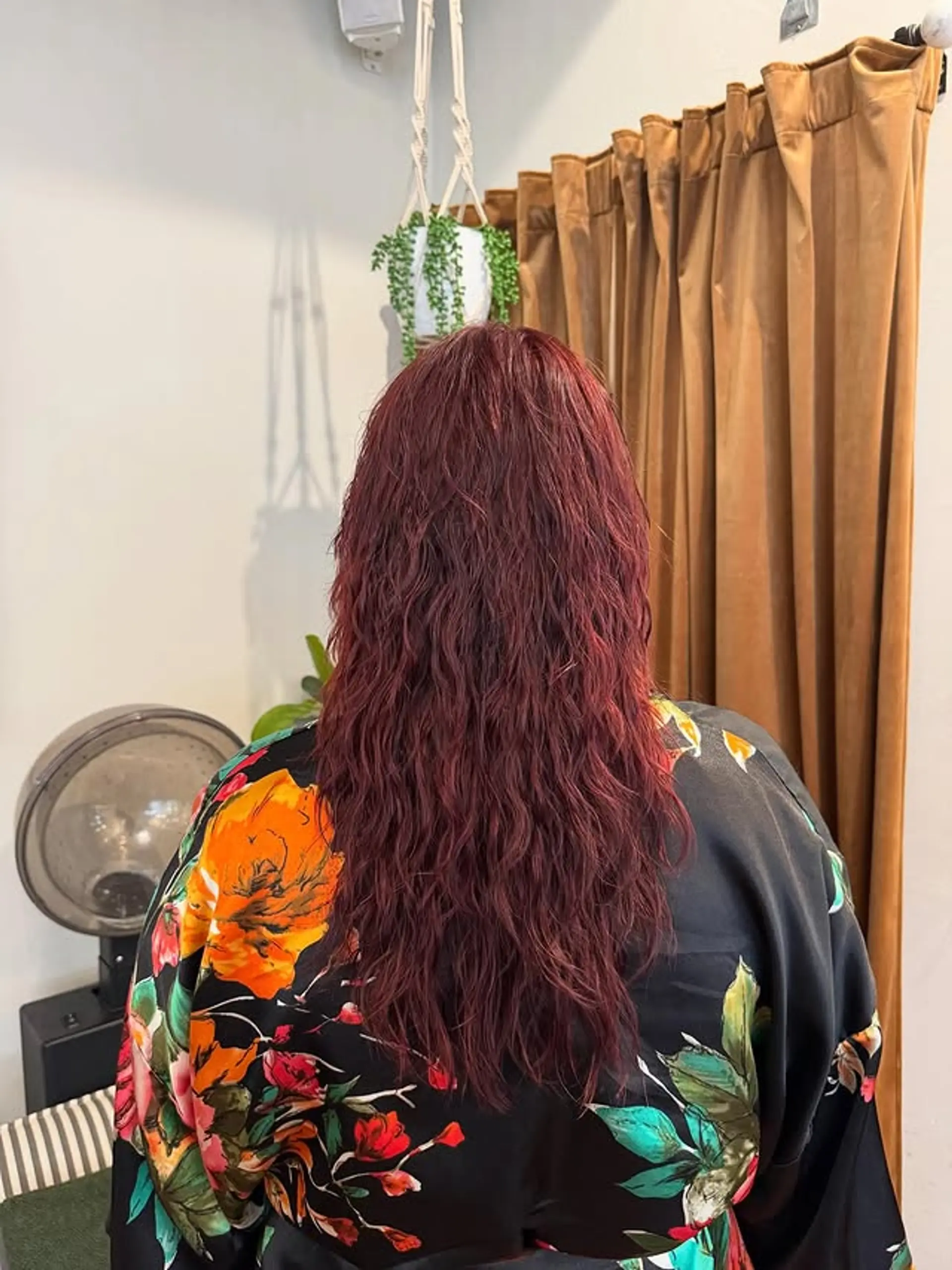 Long wavy hairstyle with rich red wine color and soft layers. 1