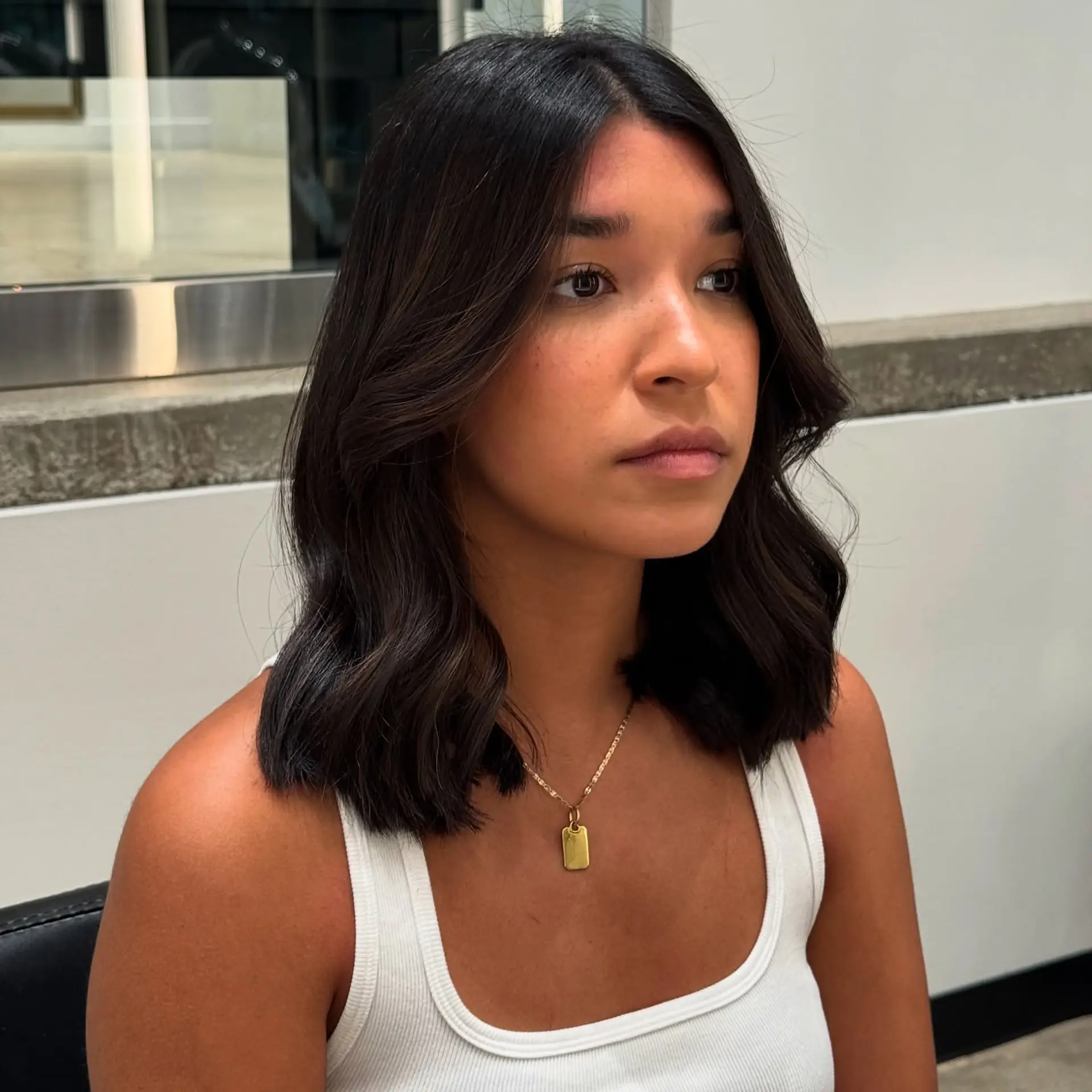 A midi-length cut with soft, flowing waves and subtle layers. 1