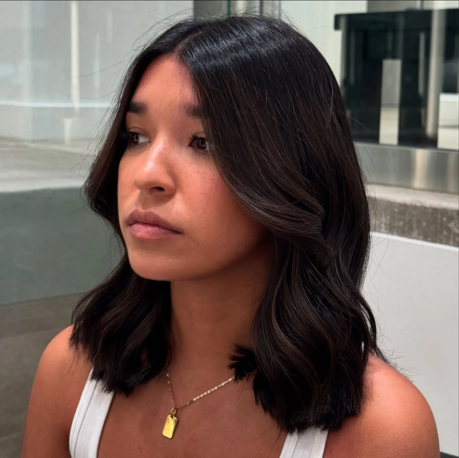 A midi-length cut with soft, flowing waves and subtle layers. 2