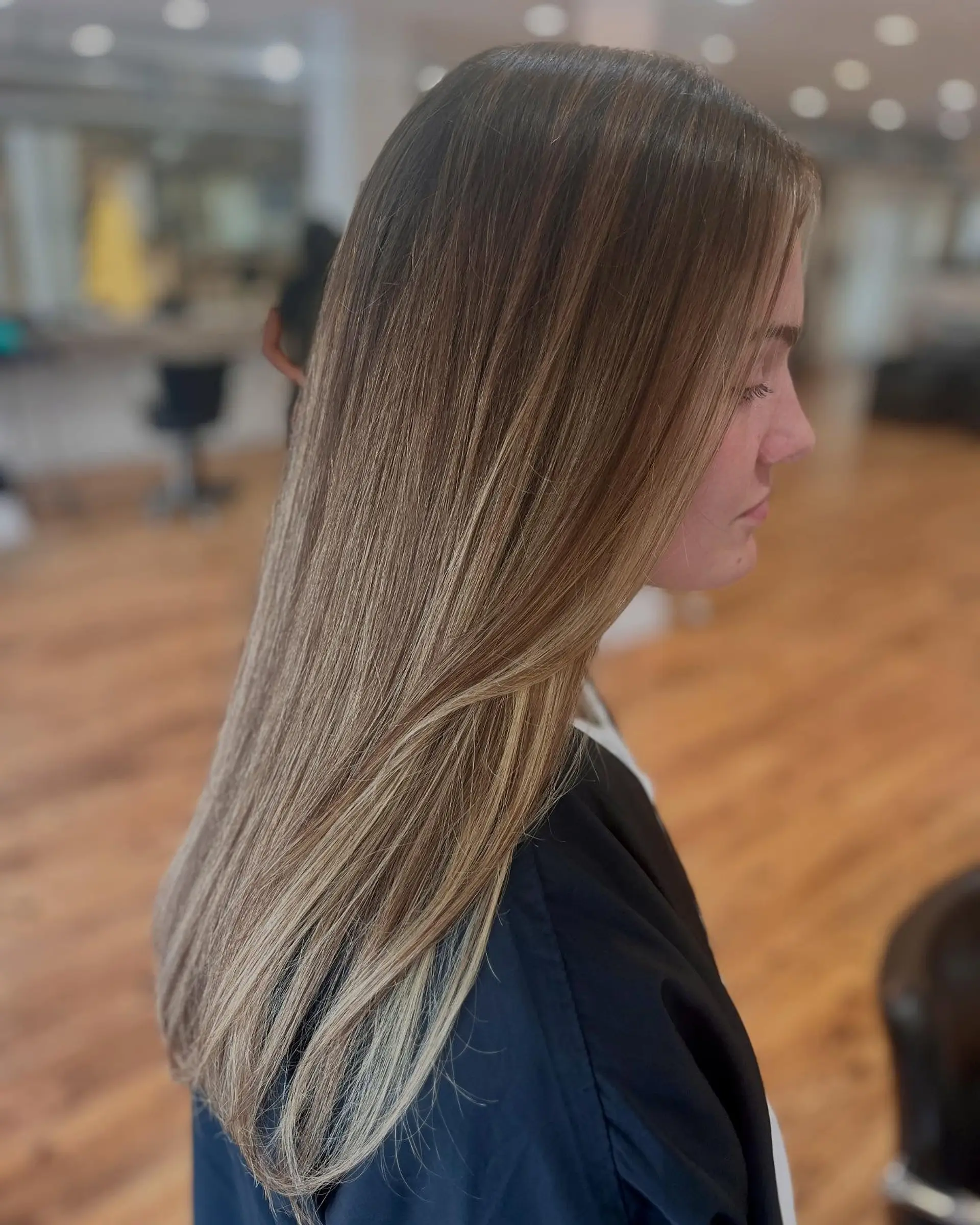 Long, straight layered hair with dimensional highlights. 2