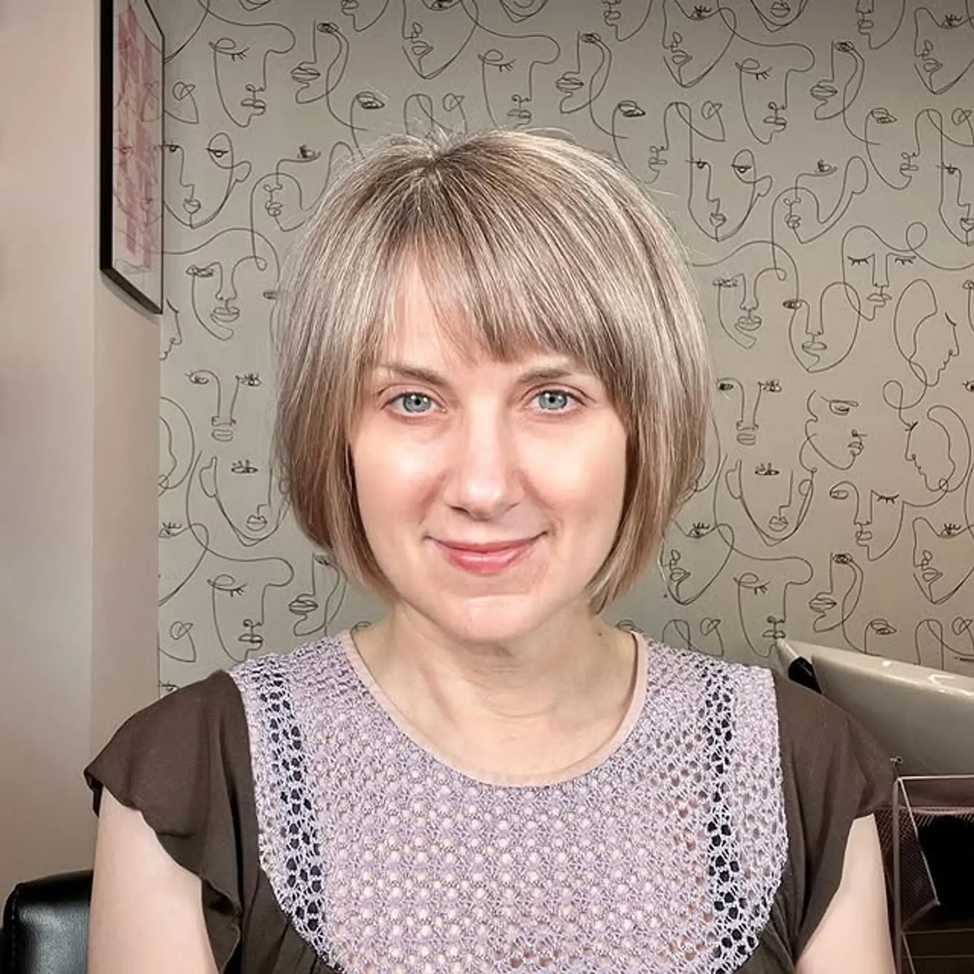 A stylish, straight blunt bob with bangs. 1