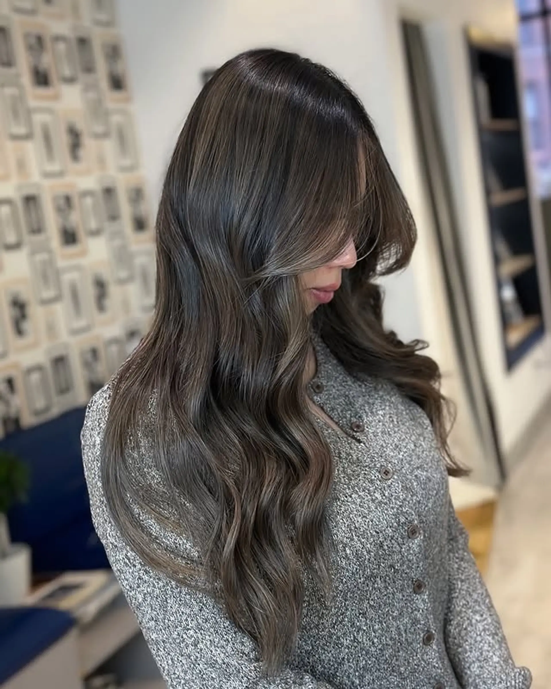 A long and wavy balayage hairstyle with ash brown tones. 1