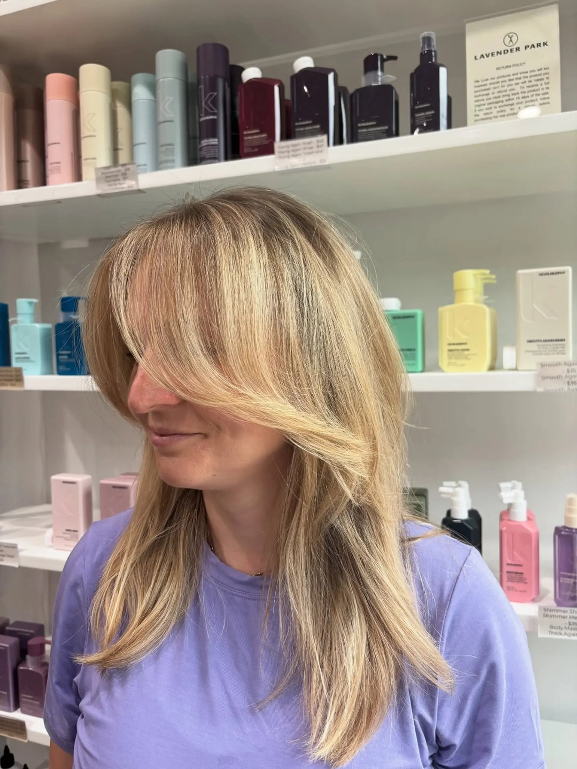 A modern shag haircut with long, voluminous layers and a soft, face-framing curtain bang. The style offers significant movement and a trendy, effortless look. 2