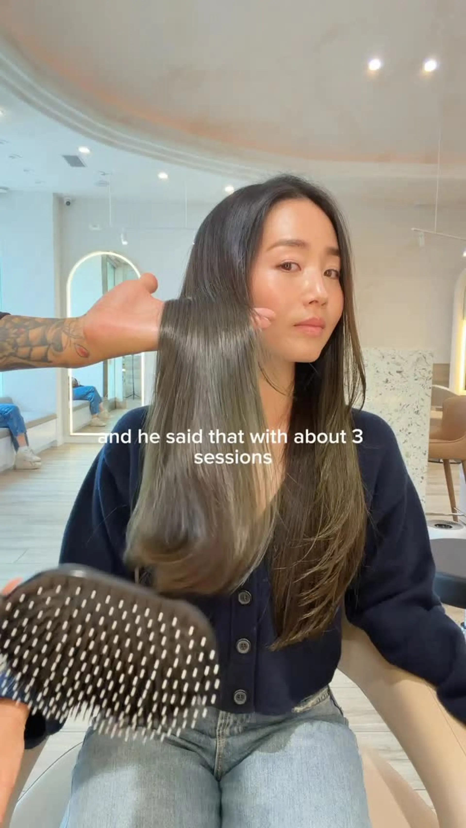 Long, ultra-glossy straight hair featuring soft subtle layers and a smooth, silky finish. 1